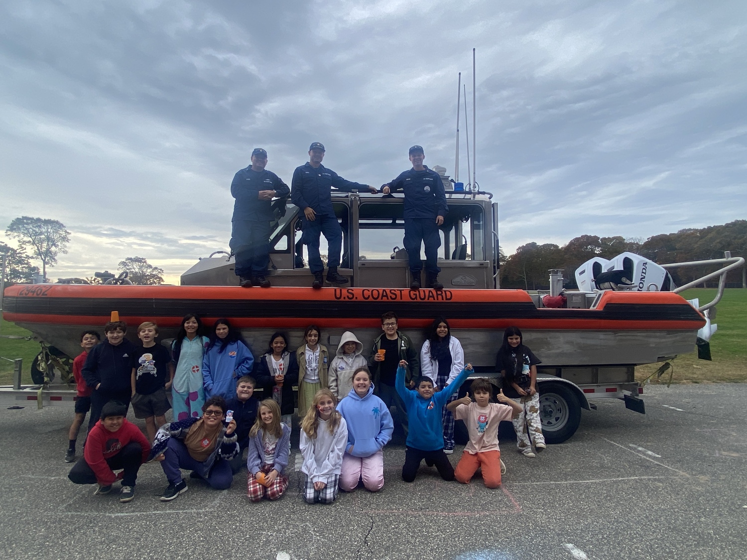 Members of the U.S. Coast Guard recently visited Hampton Bays Middle School to engage fifth grade students and educate them about their role in the community. During the visit, the service members showcased their response boat and explained various responsibilities, including search and rescue operations, maritime safety and
environmental protection. The interactive presentation aimed to inspire students and raise awareness about the importance of the Coast Guard's mission. Students had the opportunity to ask questions and learn firsthand about the critical services provided by the Coast Guard. COURTESY HAMPTON BAYS SCHOOL DISTRICT