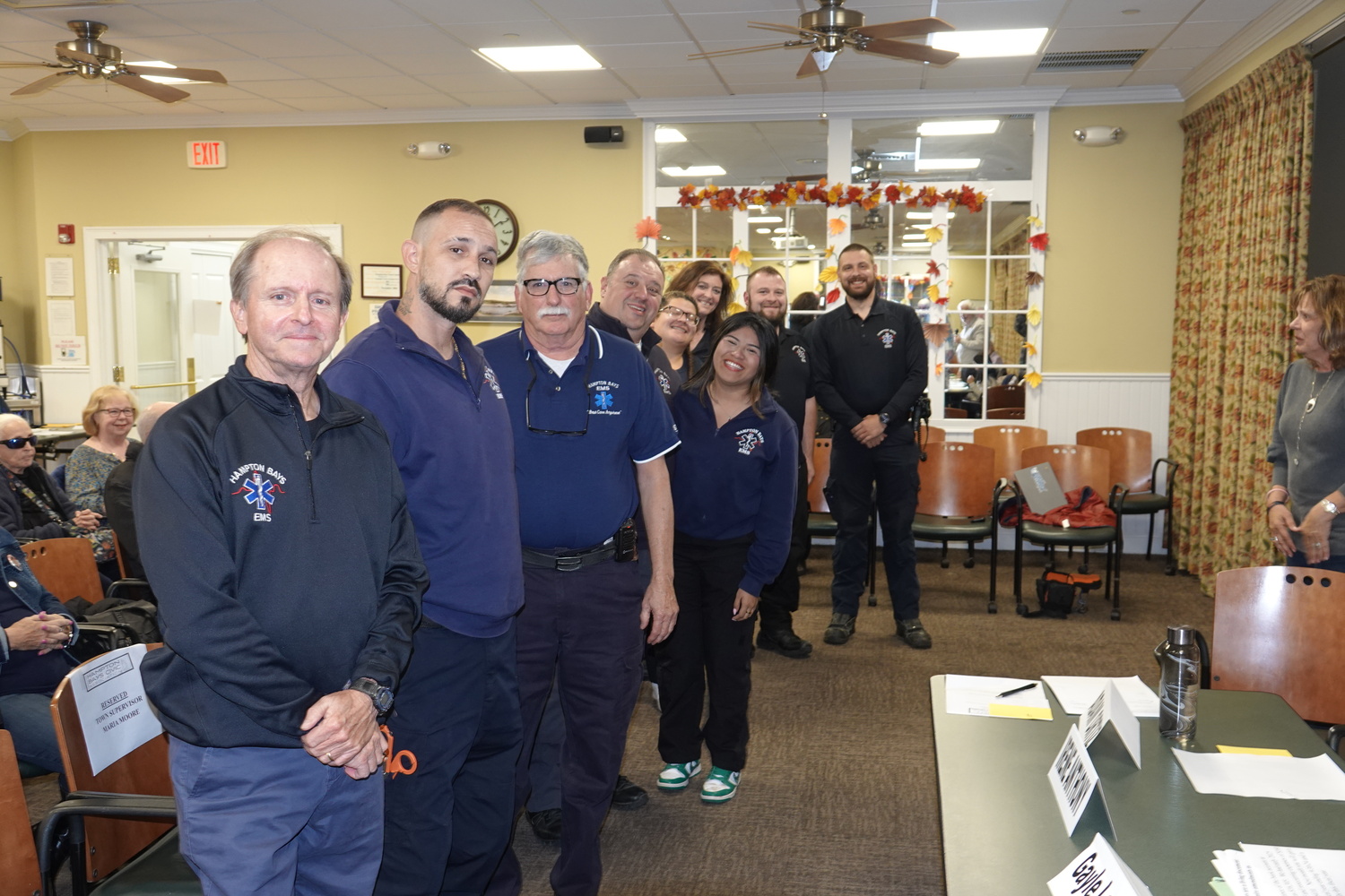 The Hampton Bays Civic Association honored members of the Hampton Bays Volunteer Ambulance Corps as its persons of the month for October and Supervisor Maria Moore presented the ambulance personnel with a proclamation applauding their dedication to the wellbeing of the people of Hampton Bays.