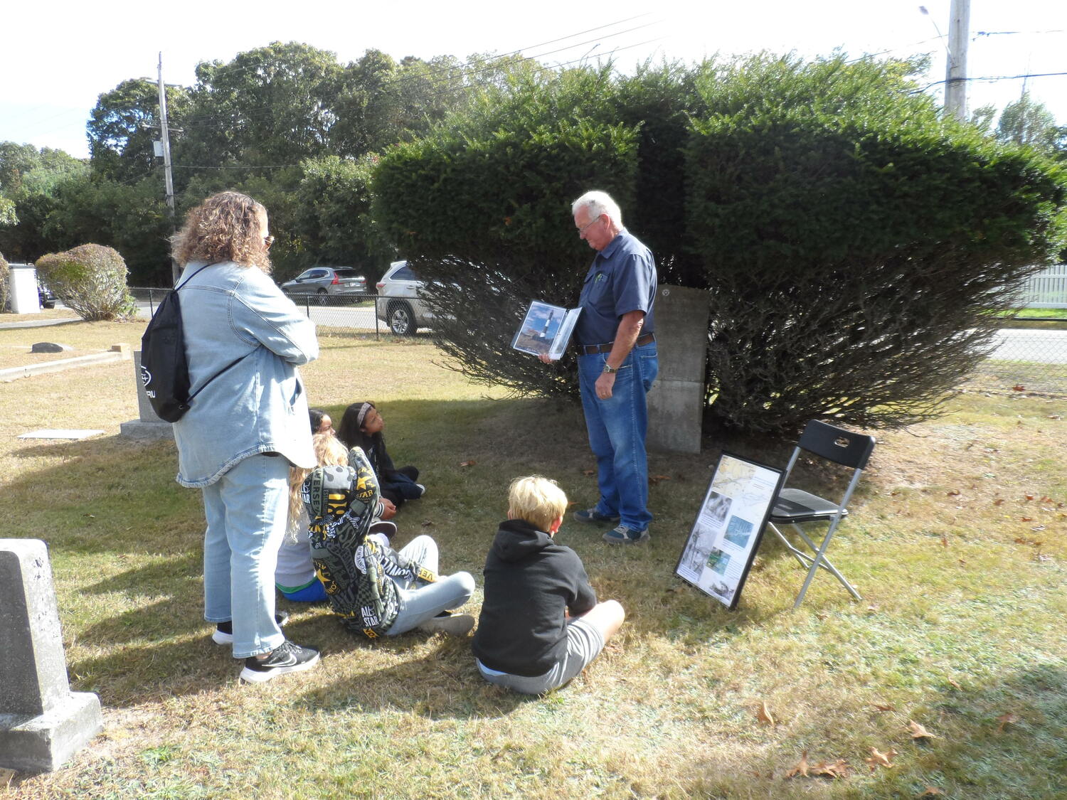 The Greater Westhampton Historical Museum hosted history lessons for Westhampton Beach Elementary School second graders at the Westhampton Cemetery recently. Tom Betjemann talked about the lost sailors memorial. COURTESY GREATER WESTHAMPTON HISTORICAL MUSEUM