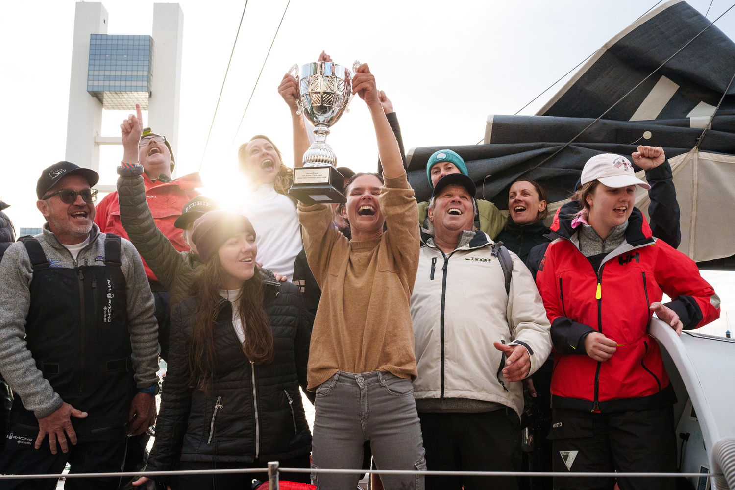 March 14 -  Cole Brauer, a 2012 East Hampton High School graduate, hoists up her silver trophy for taking second place in the Global Solo Challenge. She became the first American woman to race nonstop around the world by herself.    ALVARO SANCHIS