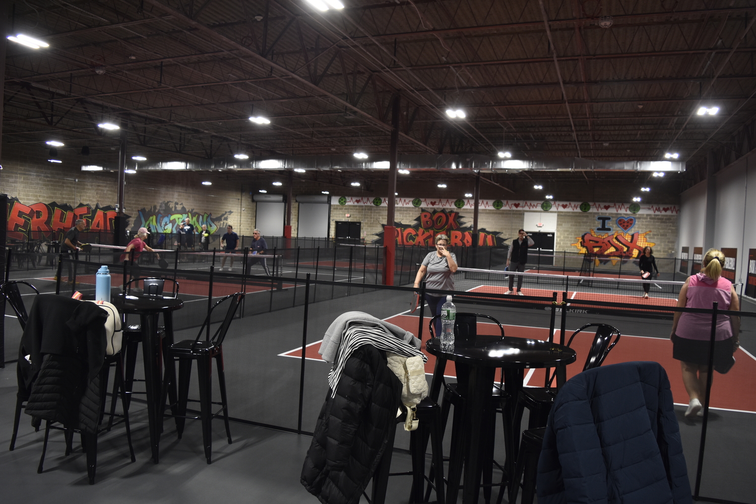 Just about an hour after opening on Saturday morning most of the courts were full at Box Pickleball, which was giving away free court time as part of its soft opening.   DREW BUDD