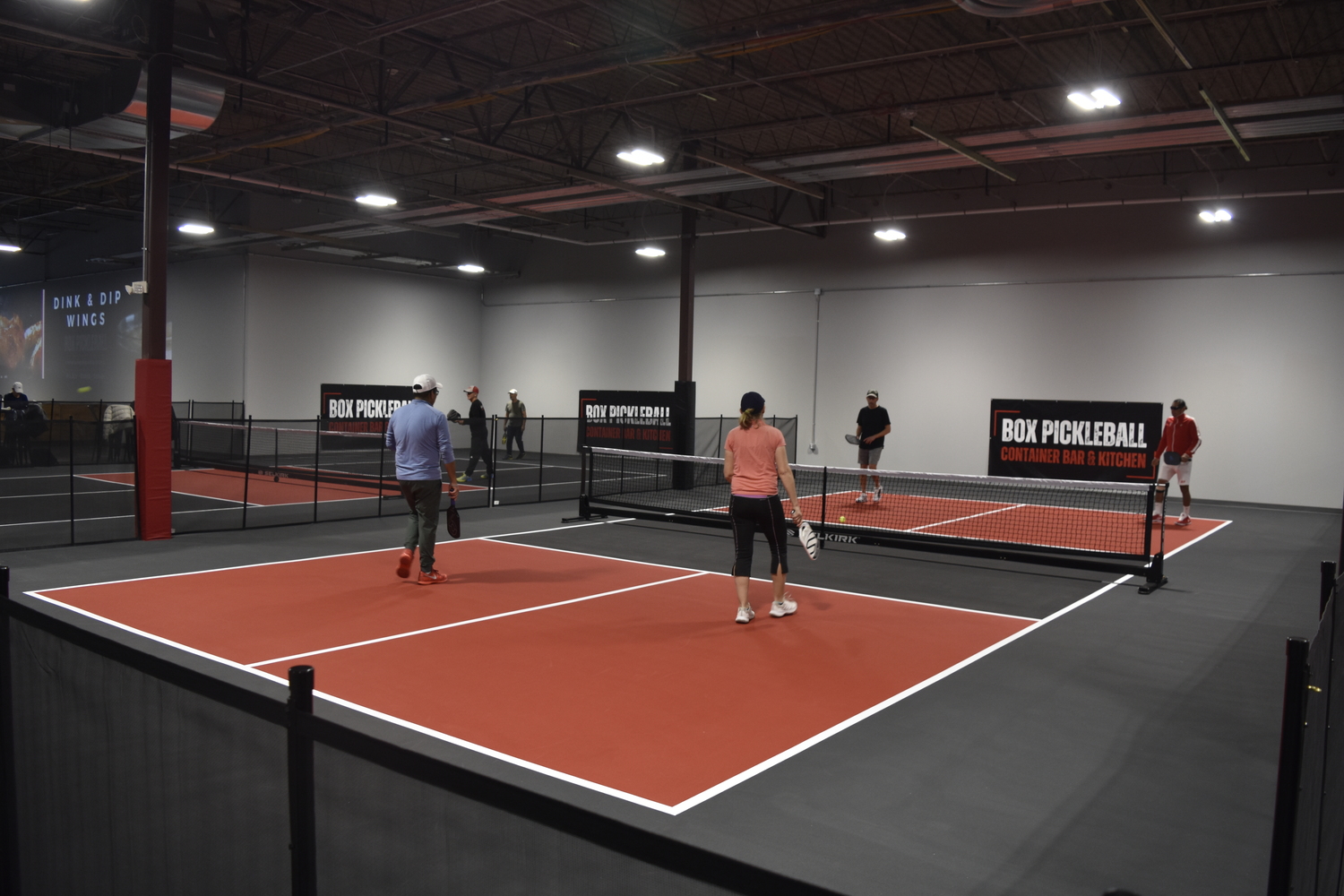 Just about an hour after opening on Saturday morning most of the courts were full at Box Pickleball, which was giving away free court time as part of its soft opening.   DREW BUDD