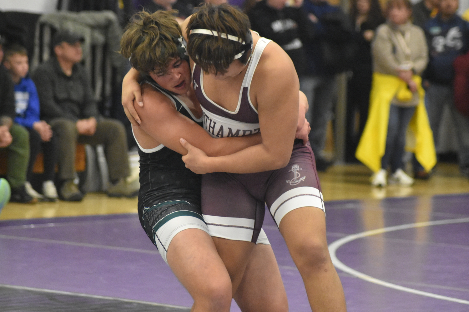 Constantine Reilly of Westhampton Beach and Southampton's Cruz Espinoza battle it out.  DREW BUDD