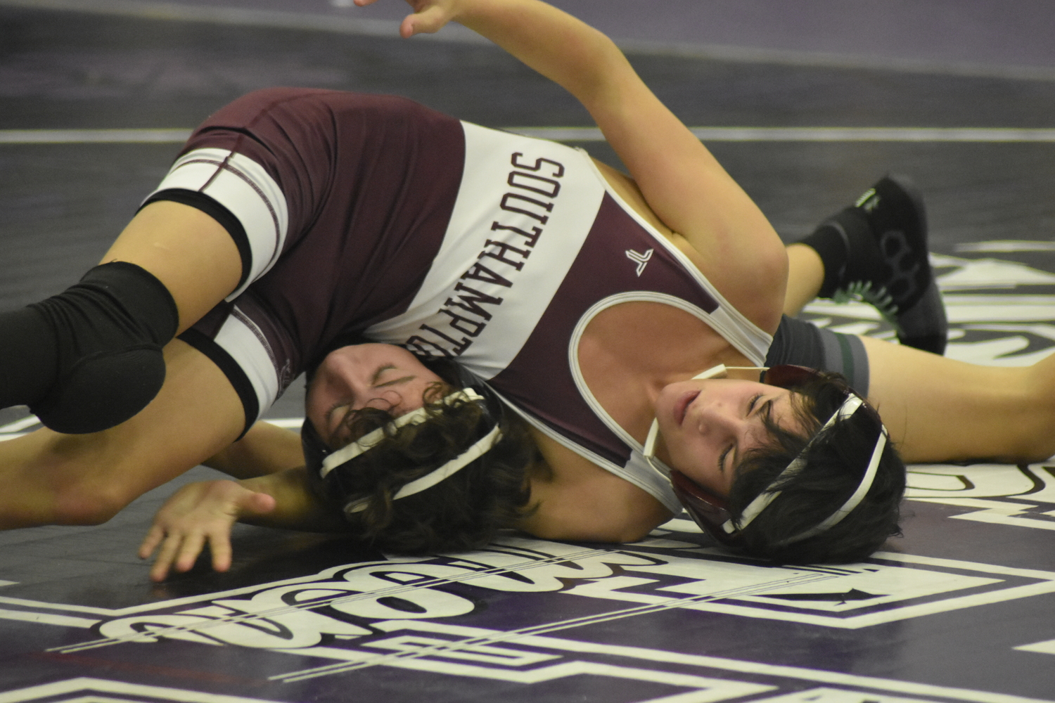 Southampton's Tyler Olivieri tries to stay on top of Logan Munsch of Westhampton Beach.  DREW BUDD