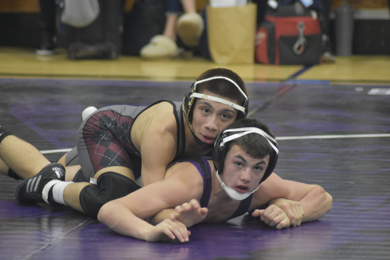 East Hampton senior Juan Roque battles Islip's Matthew Peterson.   DREW BUDD