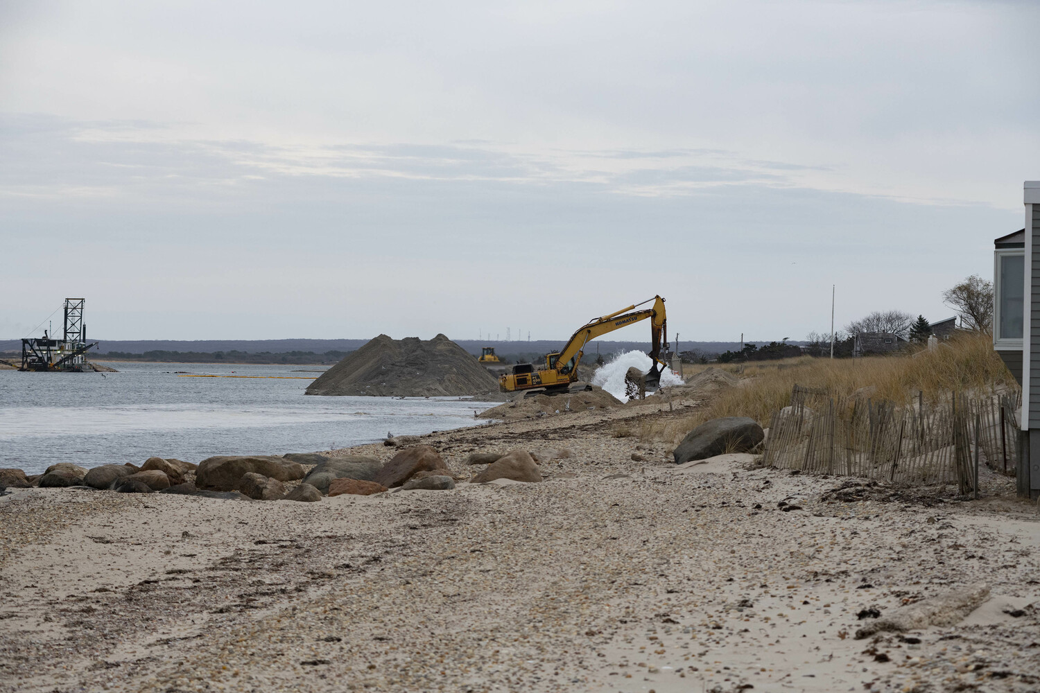 Some homeowners at Lazy Point in Amagansett are upset that the dredging of Napeague Harbor’s west channel might result in erosion of the shoreline just feet from their houses. DOUG KUNTZ