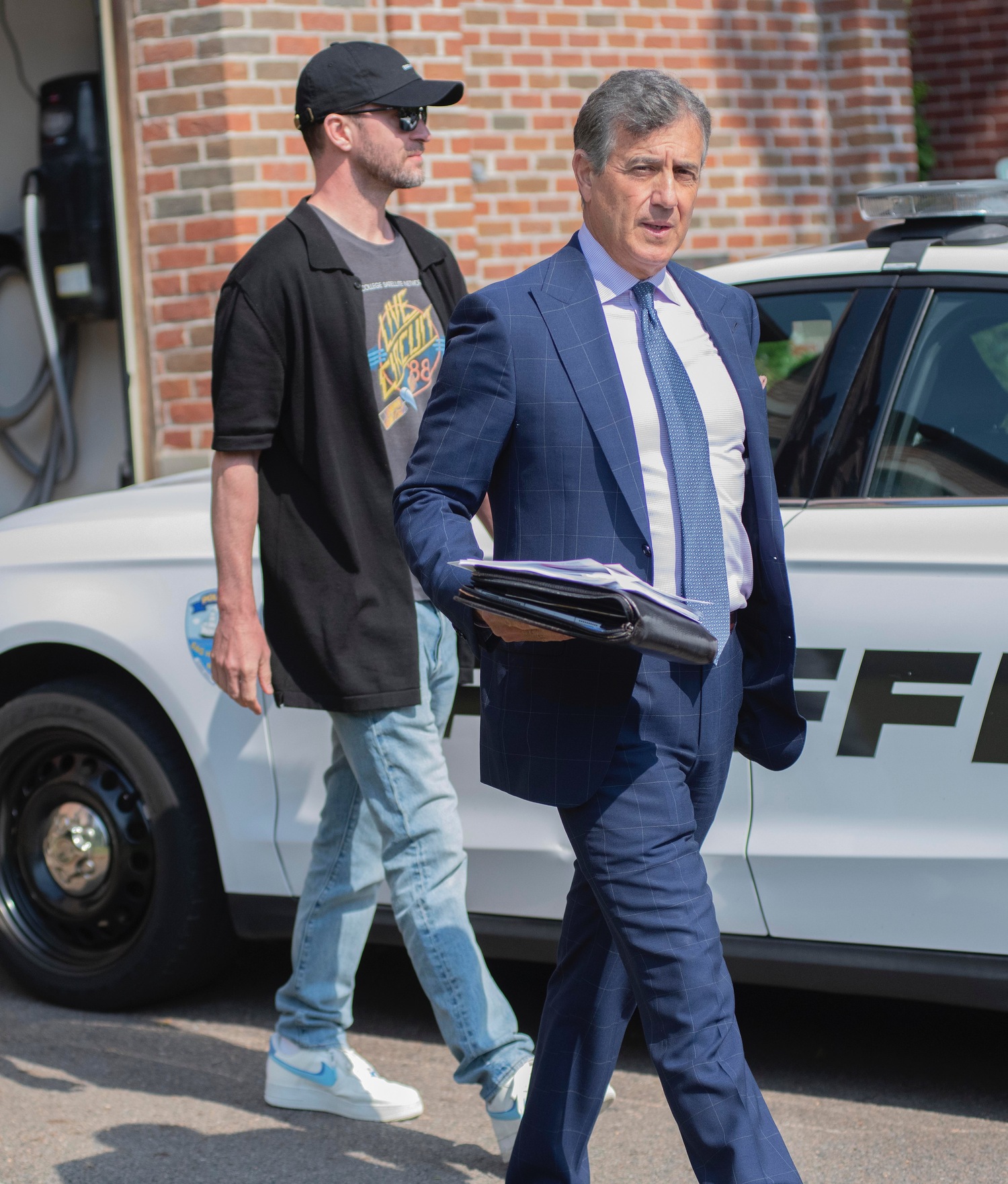 June 20 - The singer and actor Justin Timberlake was arraigned in Sag Harbor Village Justice Court on June 18 after being charged with DWI by Village Police. He was released and left the courthouse with his attorney, Edward Burke Jr., before getting into a waiting limousine.  DOUG KUNTZ