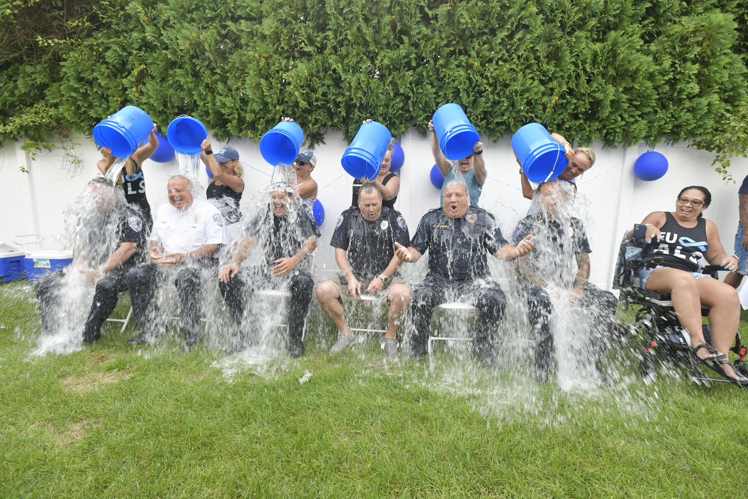 August 22 - Members of the Southampton Town Police — officer Anthony Vecchio, Chief James Kiernan, officer Chris Floria, officer Craig Slovensky, Lieutenant William Kiernan and Detective Don Metcalf — took the ice bucket challenge on August 18  at a benefit for Blythe Fickenwirth, far right, in Westhampton Beach. DANA SHAW