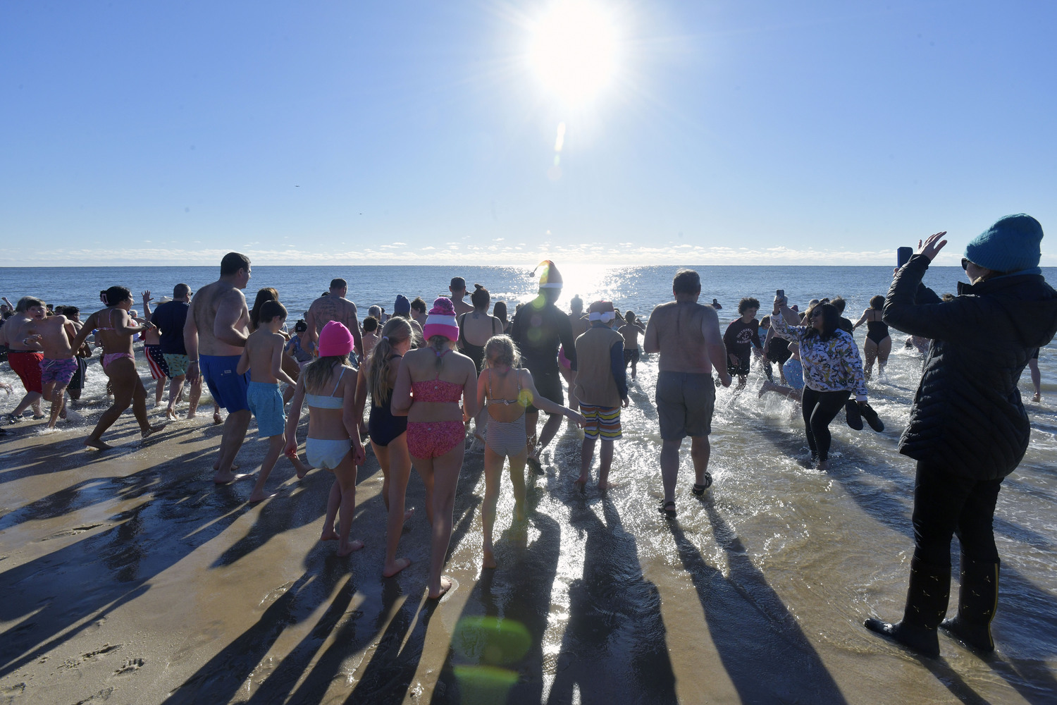 Plungers emerge from the sea.  DANA SHAW