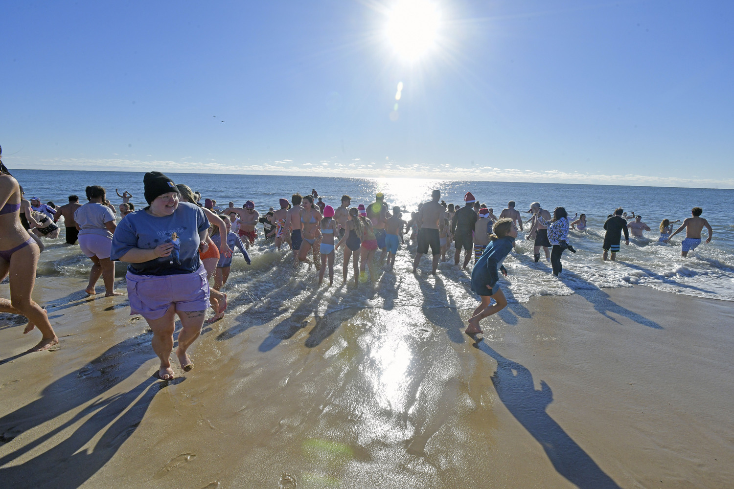 Plungers emerge from the sea.  DANA SHAW