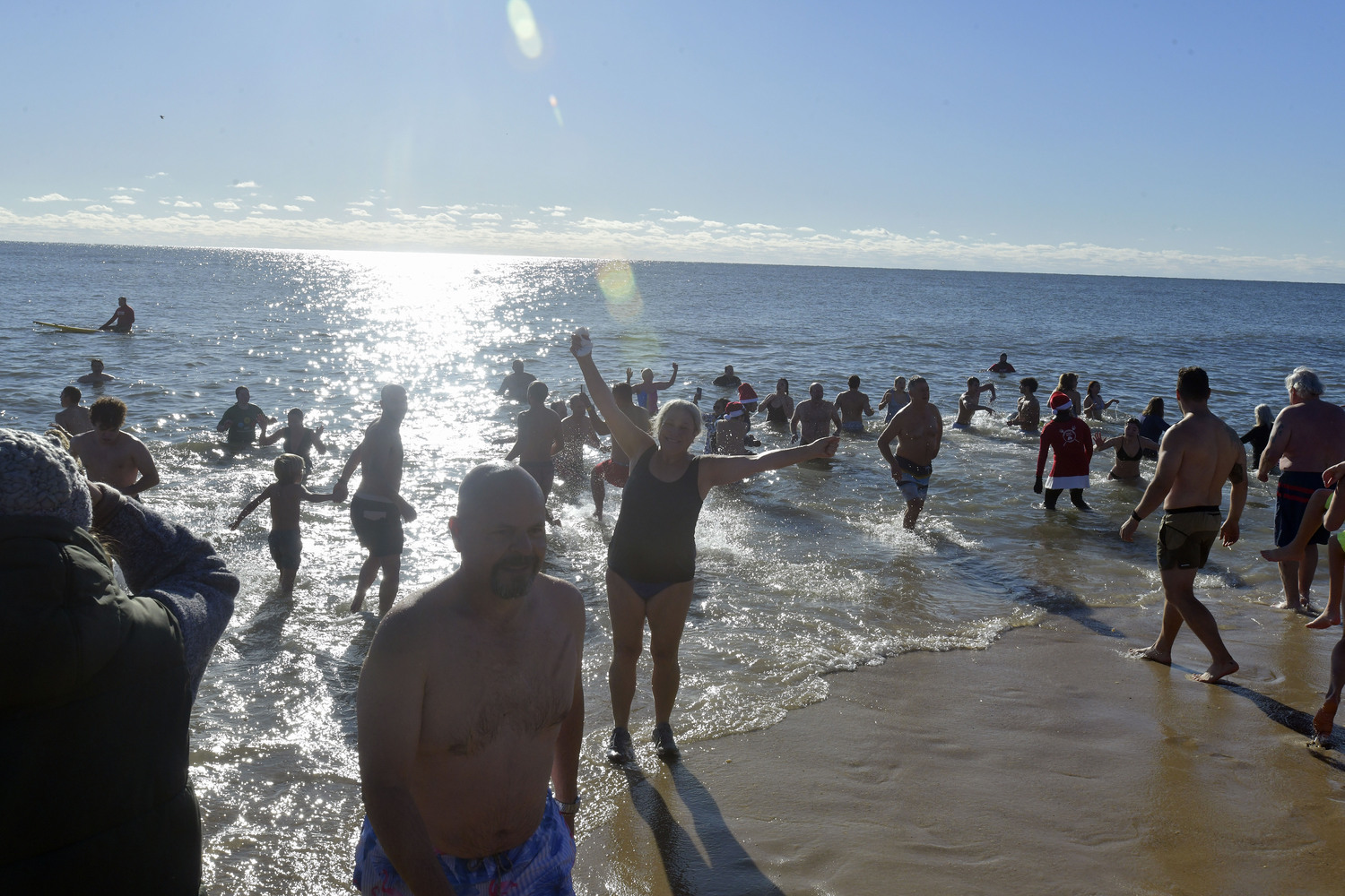 Plungers emerge from the sea.  DANA SHAW