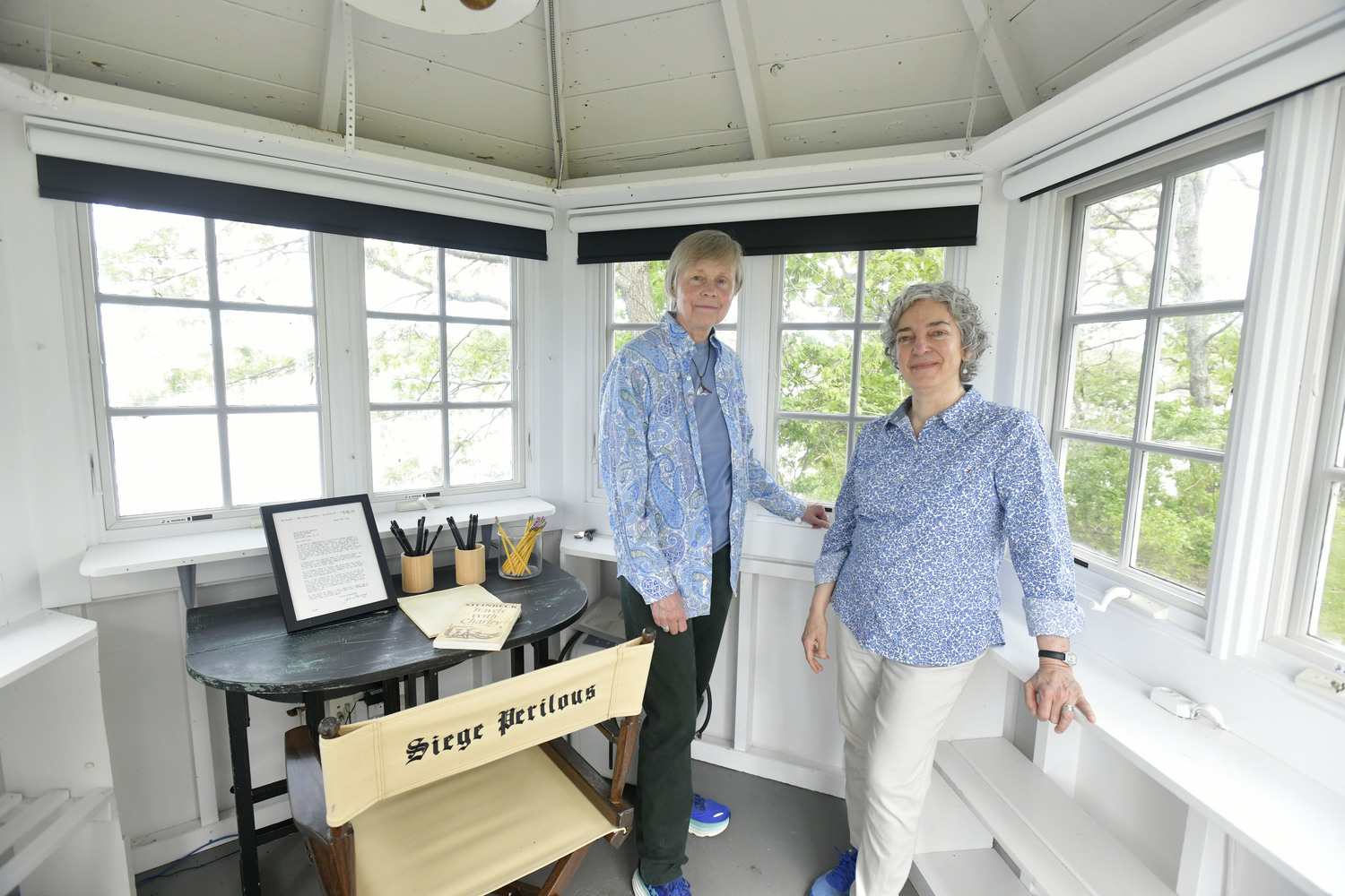 May 30 - Canio’s owners Kathryn Szoka and Maryann Calendrille in Joyous Garde, John Steinbeck’s writing studio in Sag Harbor. DANA SHAW