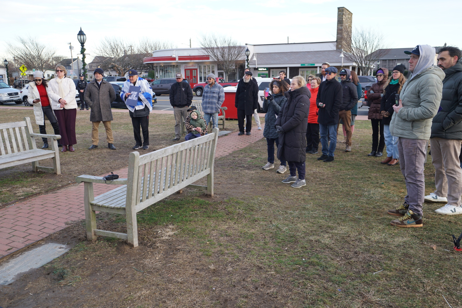 Around 30 residents braved the cold to rally against anti-Semitism in Montauk on December 19. DOUG KUNTZ