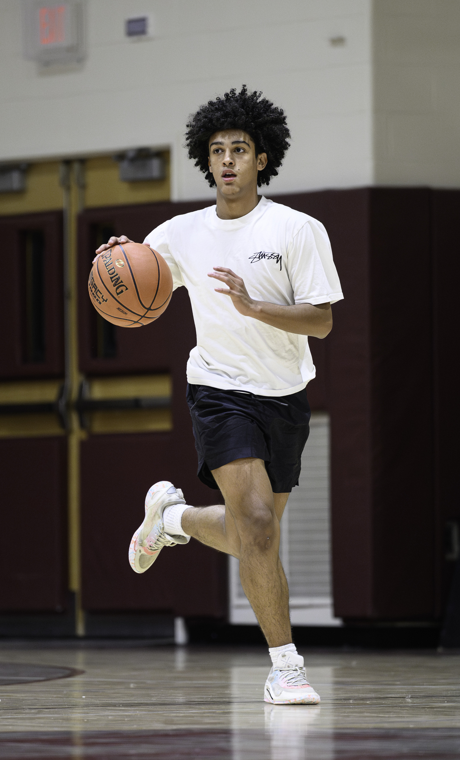 Sam Vargas dribbles the ball down the court during practice on Monday evening.    MARIANNE BARNETT