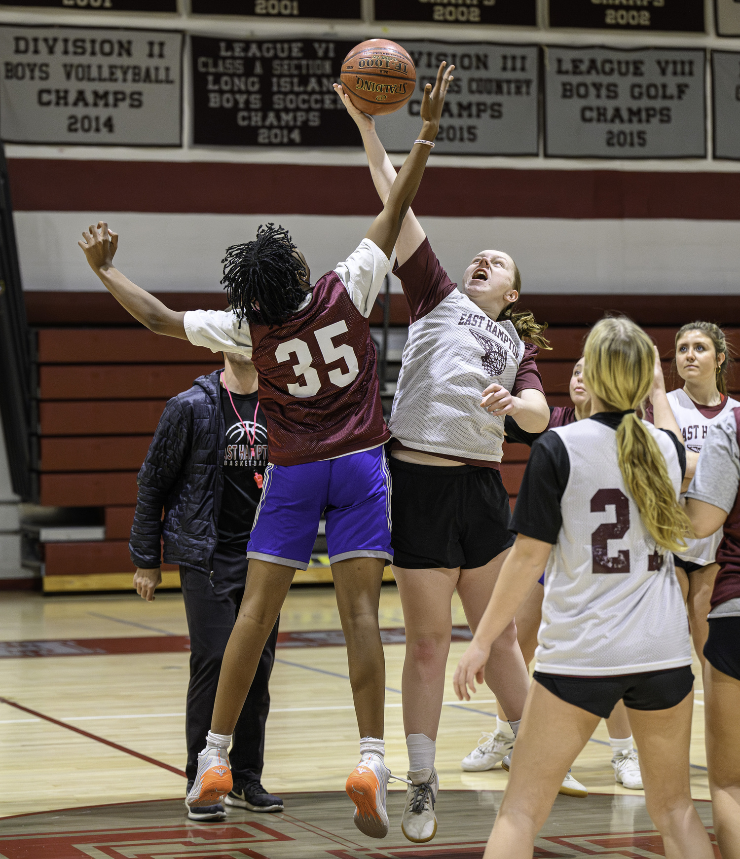 Susie DiSunno and K.K. Moore go up for a jump ball in practice.  MARIANNE BARNETT