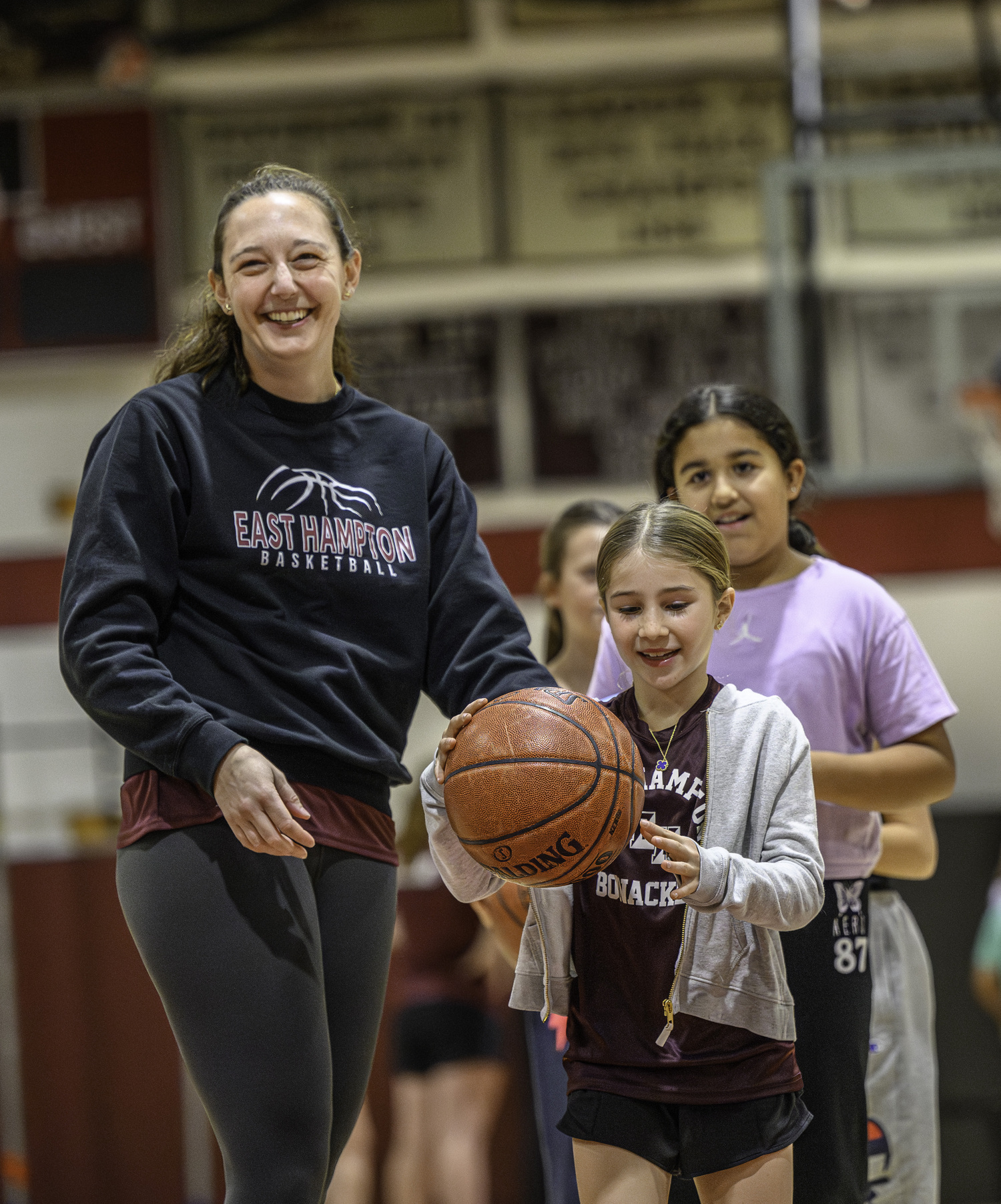 Samantha James having a good during her team's clinic for third- and fourth-graders on Monday night.   MARIANNE BARNETT