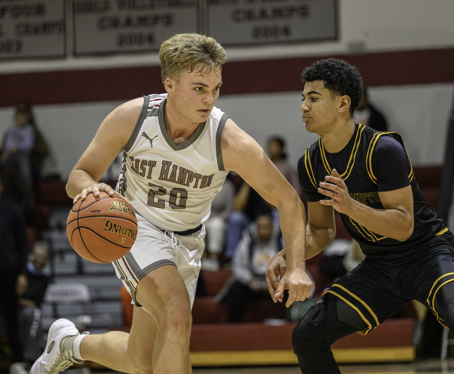 East Hampton senior Carter Dickinson brings the ball up the court.  MARIANNE BARNETT