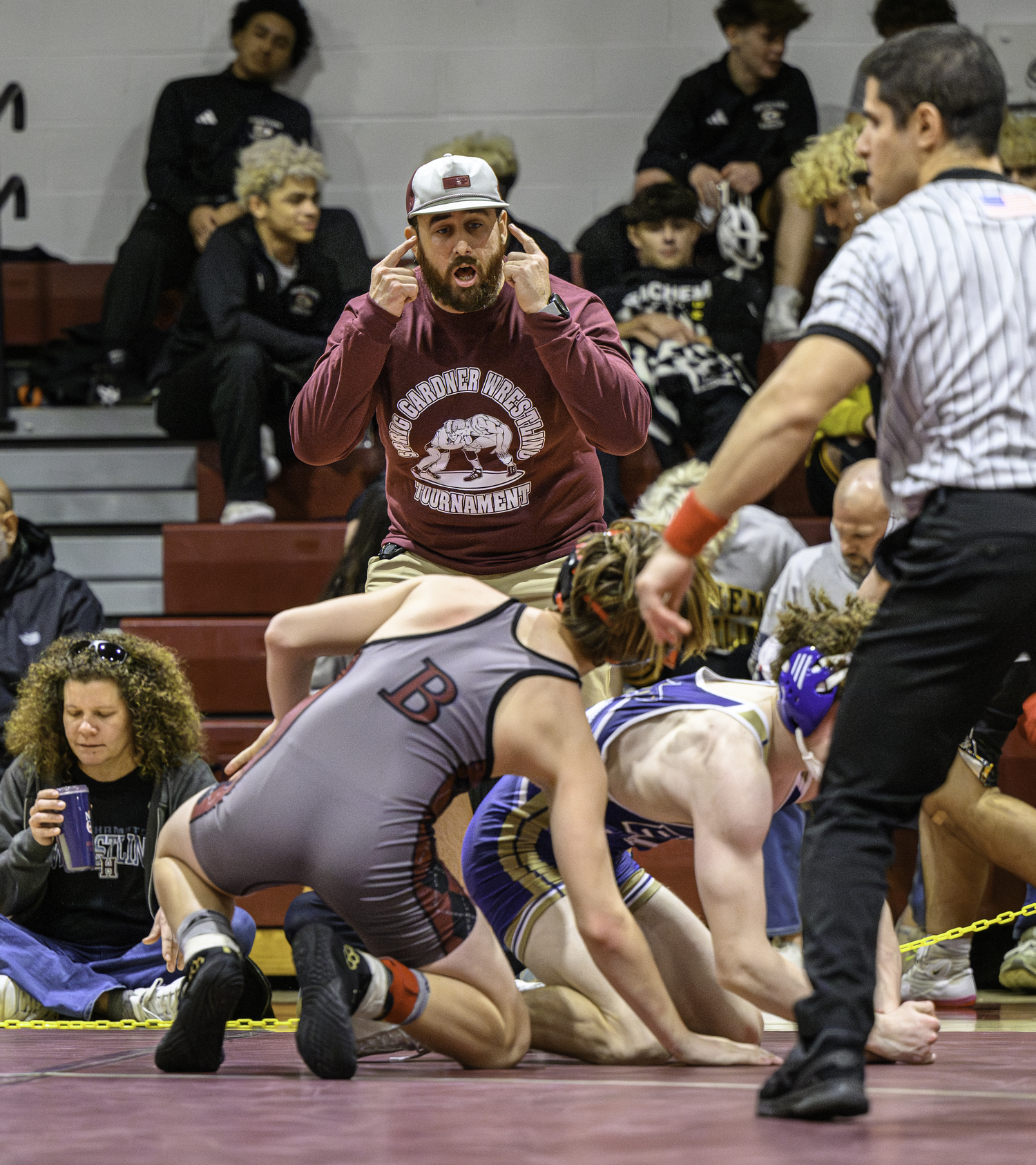 Bonac head coach Ethan Mitchell directs his wrestler.    MARIANNE BARNETT