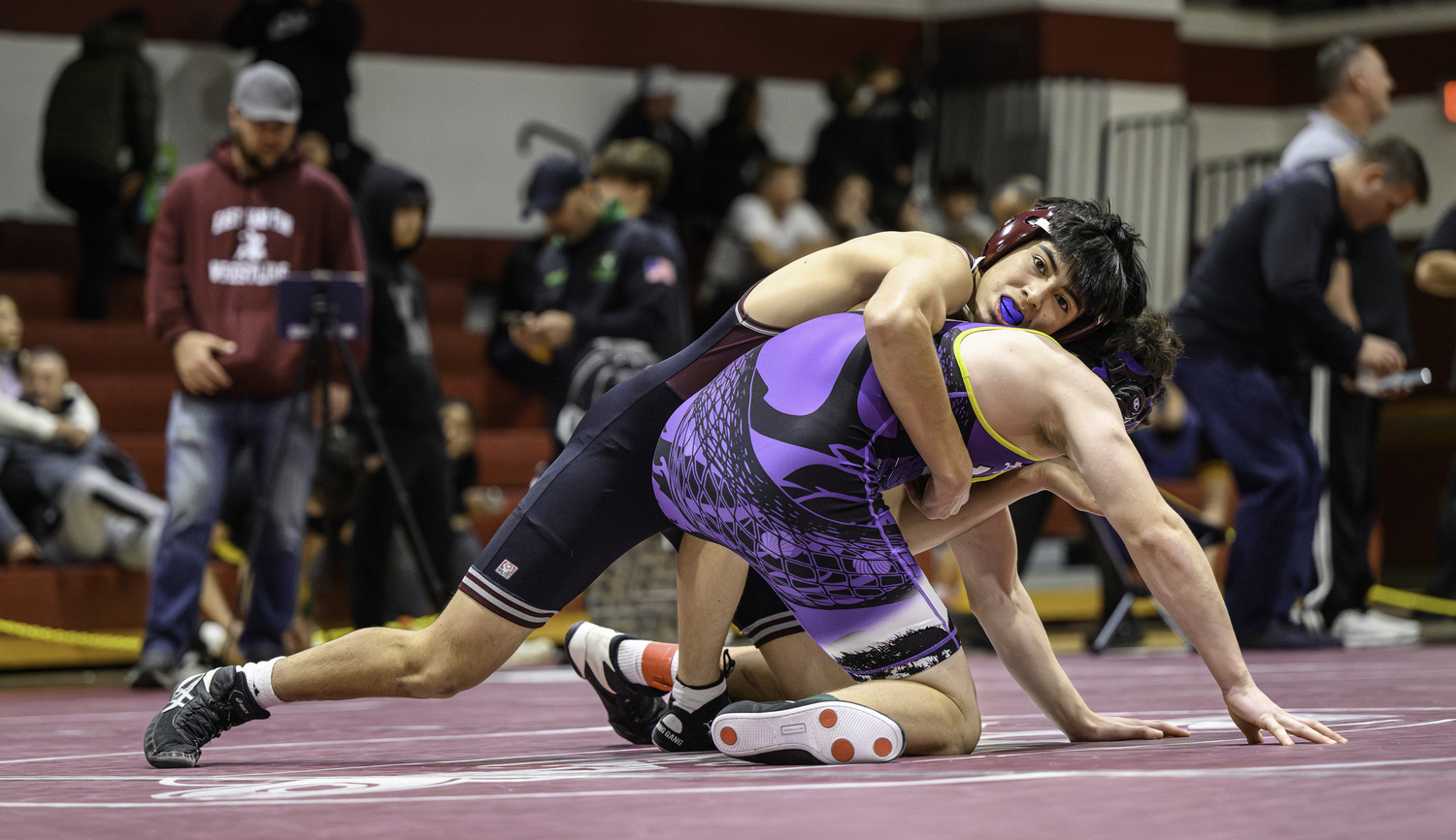 Matias Armijos has top control on his Hampton Bays opponent.  MARIANNE BARNETT