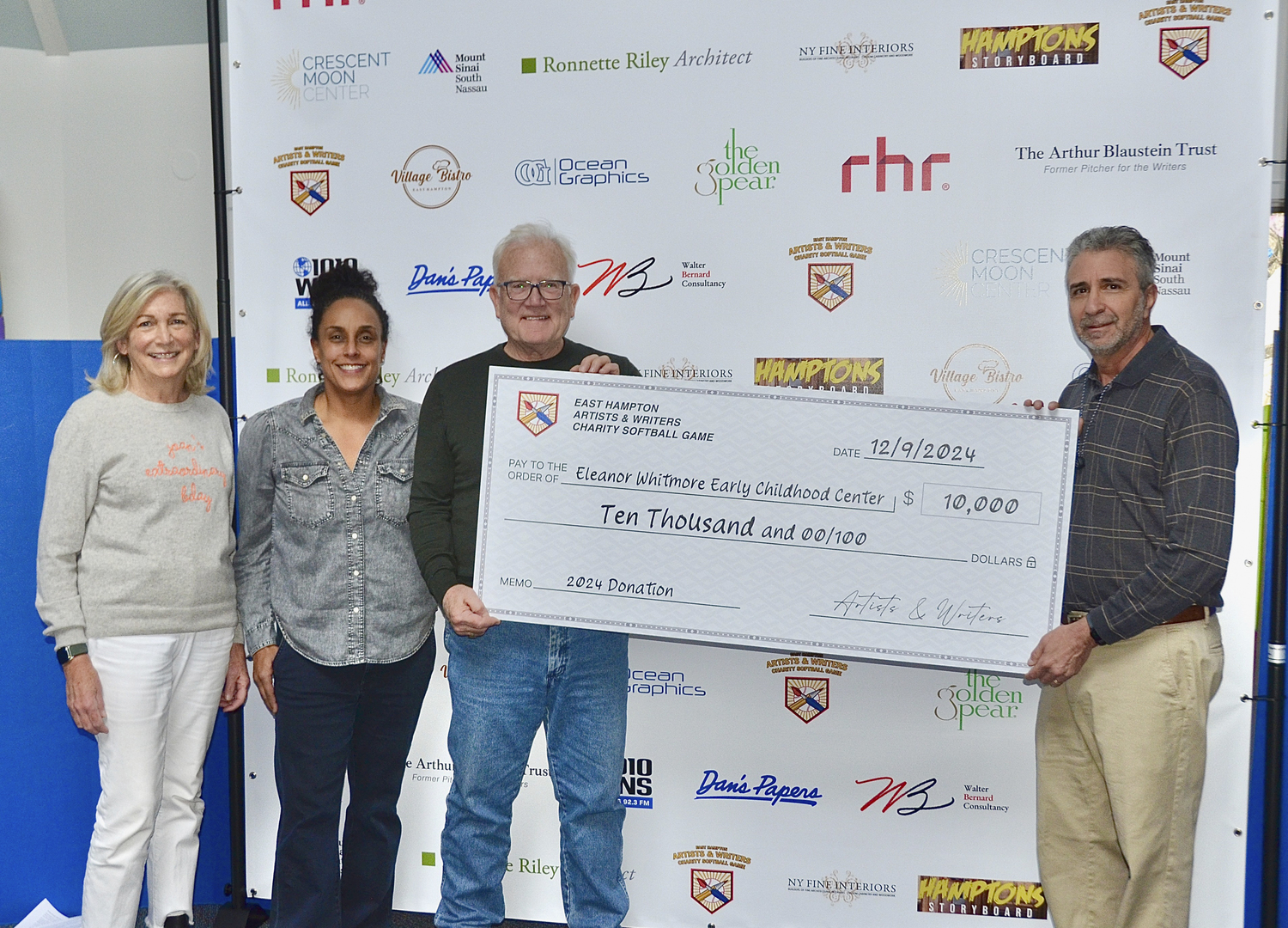 The Eleanor Whitmore Early Childhood Center was just one of the recipients of the proceeds from this past summer's East Hampton Artist and Writers Charity Softball Game. Other organizations included The Retreat and East End Hospice, from the center, left to right are:  Joan Overlock, Mercedes Counihan, Tim Frazier and David Brandman, David Brandman President of the Artist and Writers Charity Softball Game.  KYRIL BROMLEY