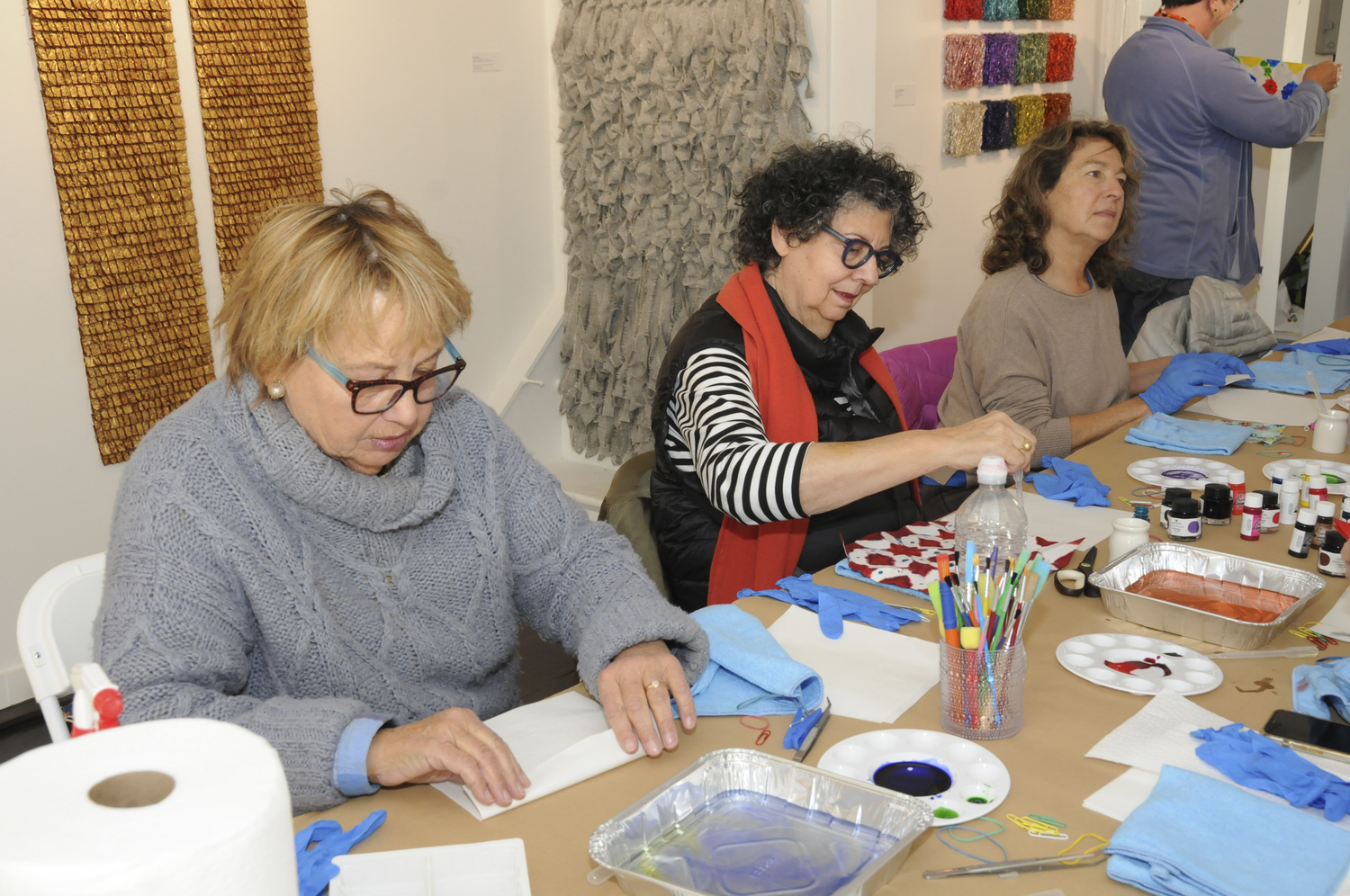 Irene Tully, Iris Weinstein and Beth Josephs at the Women's Arts Center of the Hamptons Japanese Folding and Dye Workshop on Sunday.  RICHARD LEWIN