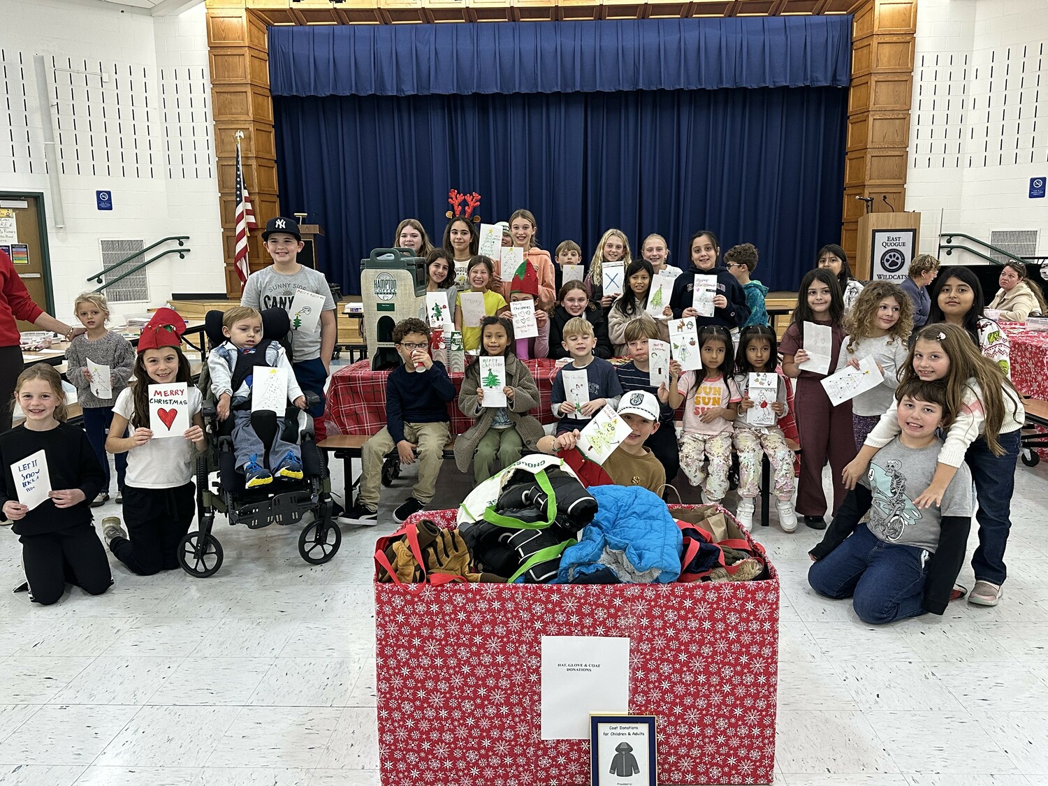 East Quogue Elementary School hosted its holiday Wildcats Give Back event. Students wrote holiday cards for homebound senior citizens and donated winter clothing to those in need. COURTESY EAST QUOGUE SCHOOL DISTRICT