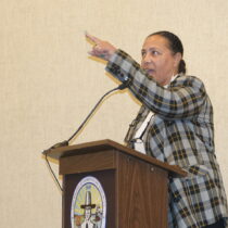 Shinnecock Nation Chairwoman Lisa Goree pointed to the nation's tribal seal on the wall above the heads of Town Board members on Thursday, saying that if the board does not count the tribal members as among its constituents it should remove the seal. A split board voted later to take the Shinnecock to court over the development of a gas station in Hampton Bays that residents of the hamlet have decried as illegal. MICHAEL WRIGHT