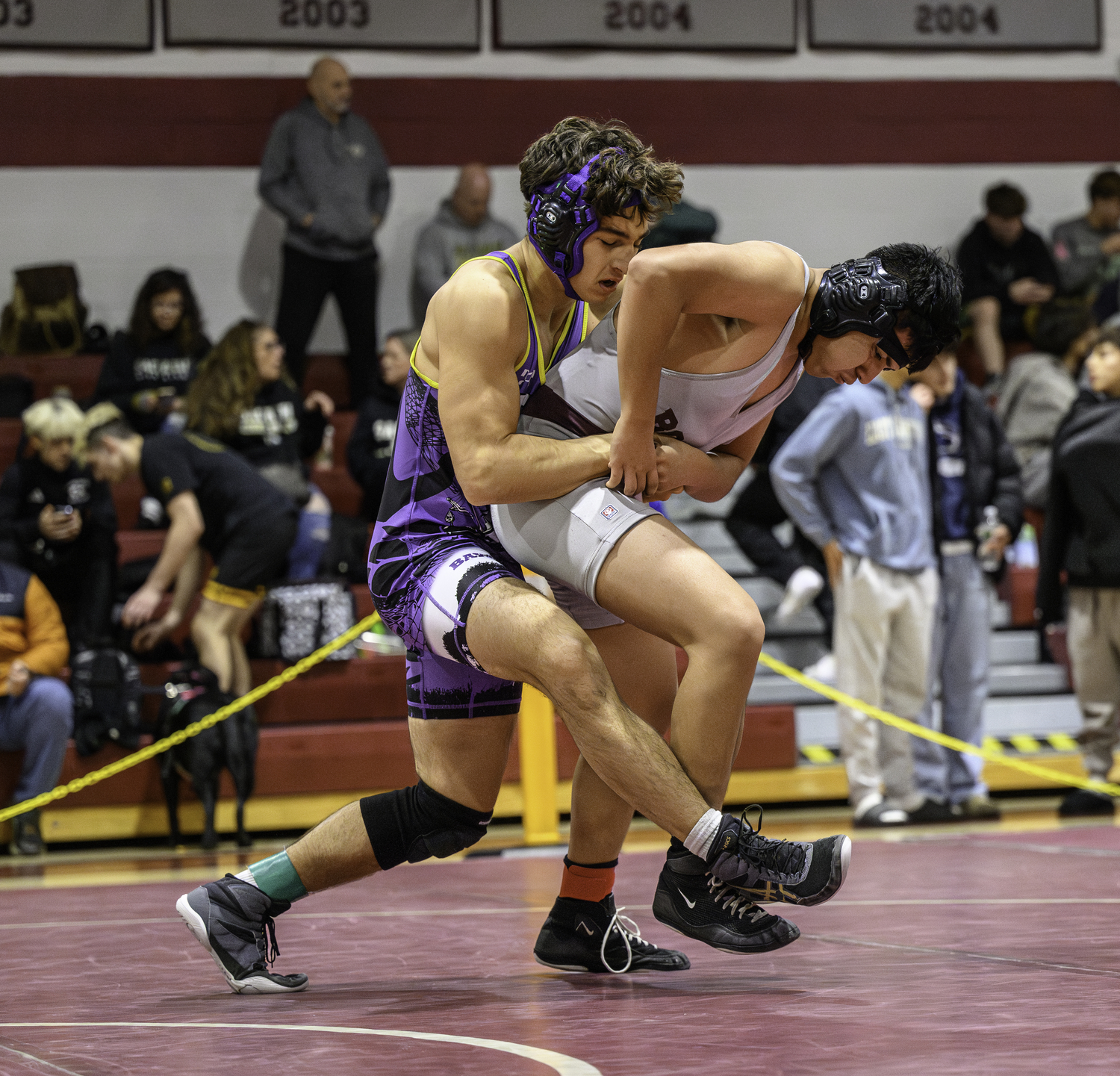 Willem Sarkis tries to take down his East Hampton opponent. MARIANNE BARNETT