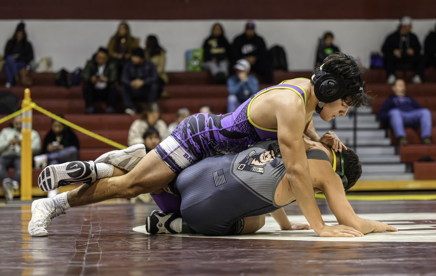 Hampton Bays senior Kevin Saa Pacheco works on top of his Ward Melville opponent. MARIANNE BARNETT