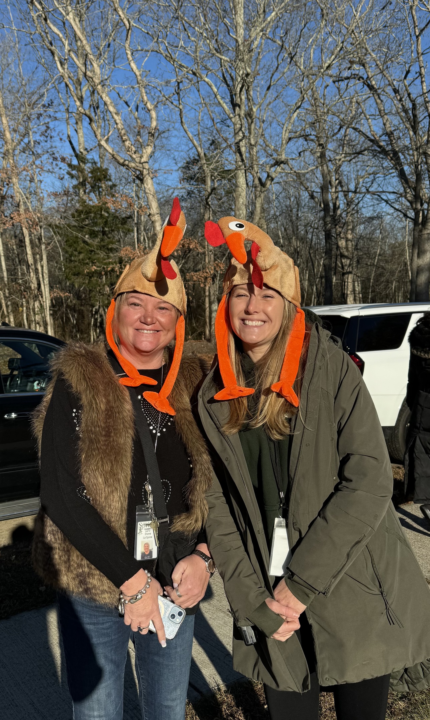 School librarian Diana LaSpina and second grade teacher Monique Sullivan embrace the spirit of the Turkey Trot.