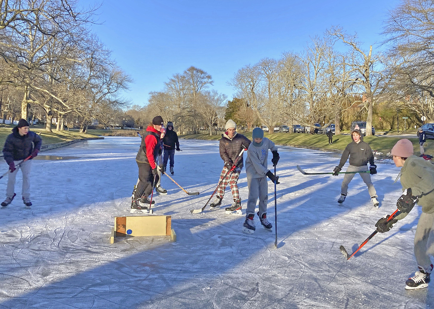 January 25 - Temperatures dropped down enough to allow for a small game of hockey on Town Pond in East Hampton on January 21. KYRIL BROMLEY