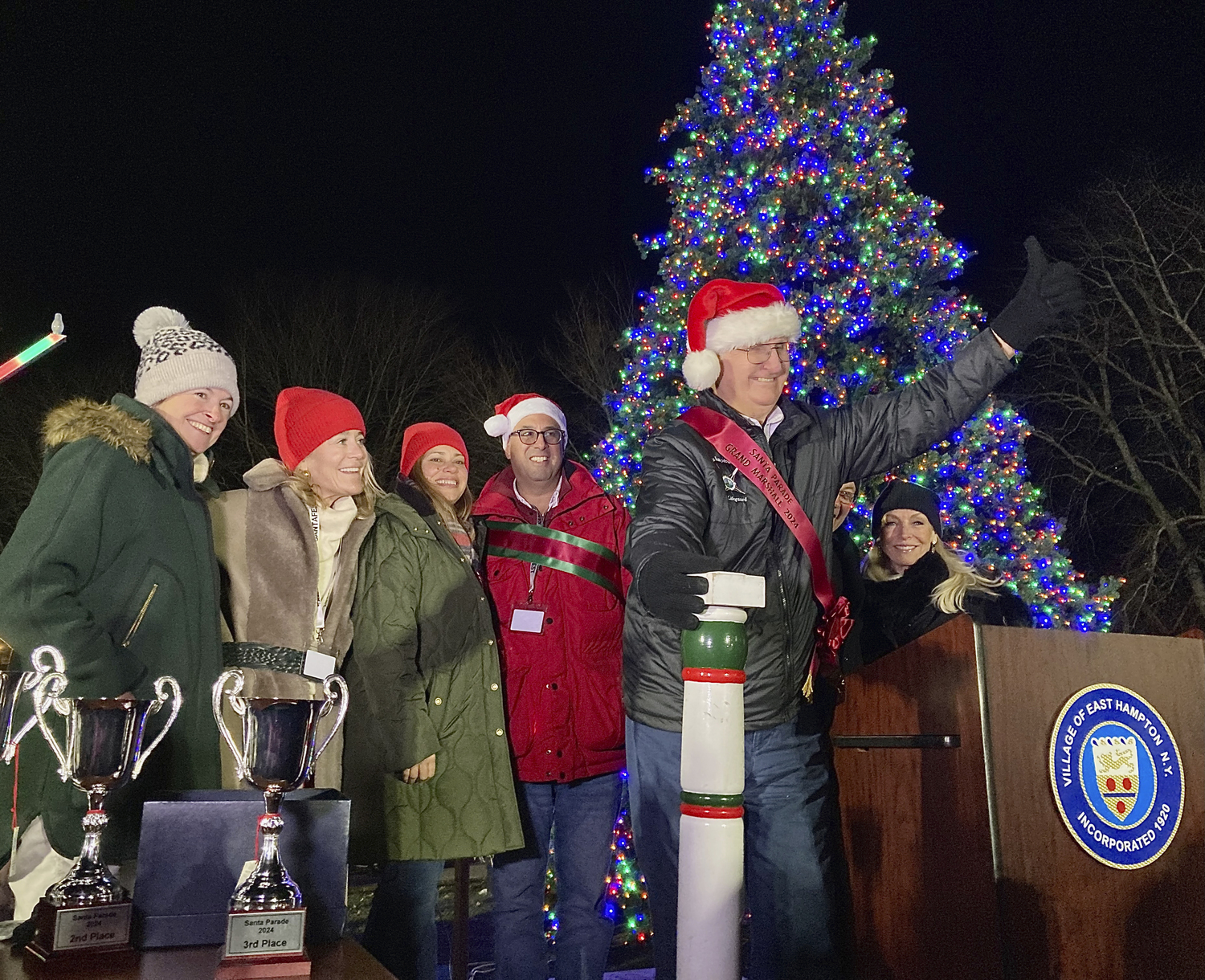 John Ryan Sr., Grandfather Marshal of the Santa Parade, lights the tree in Herrick Park on Saturday evening.  KYRIL BROMLEY