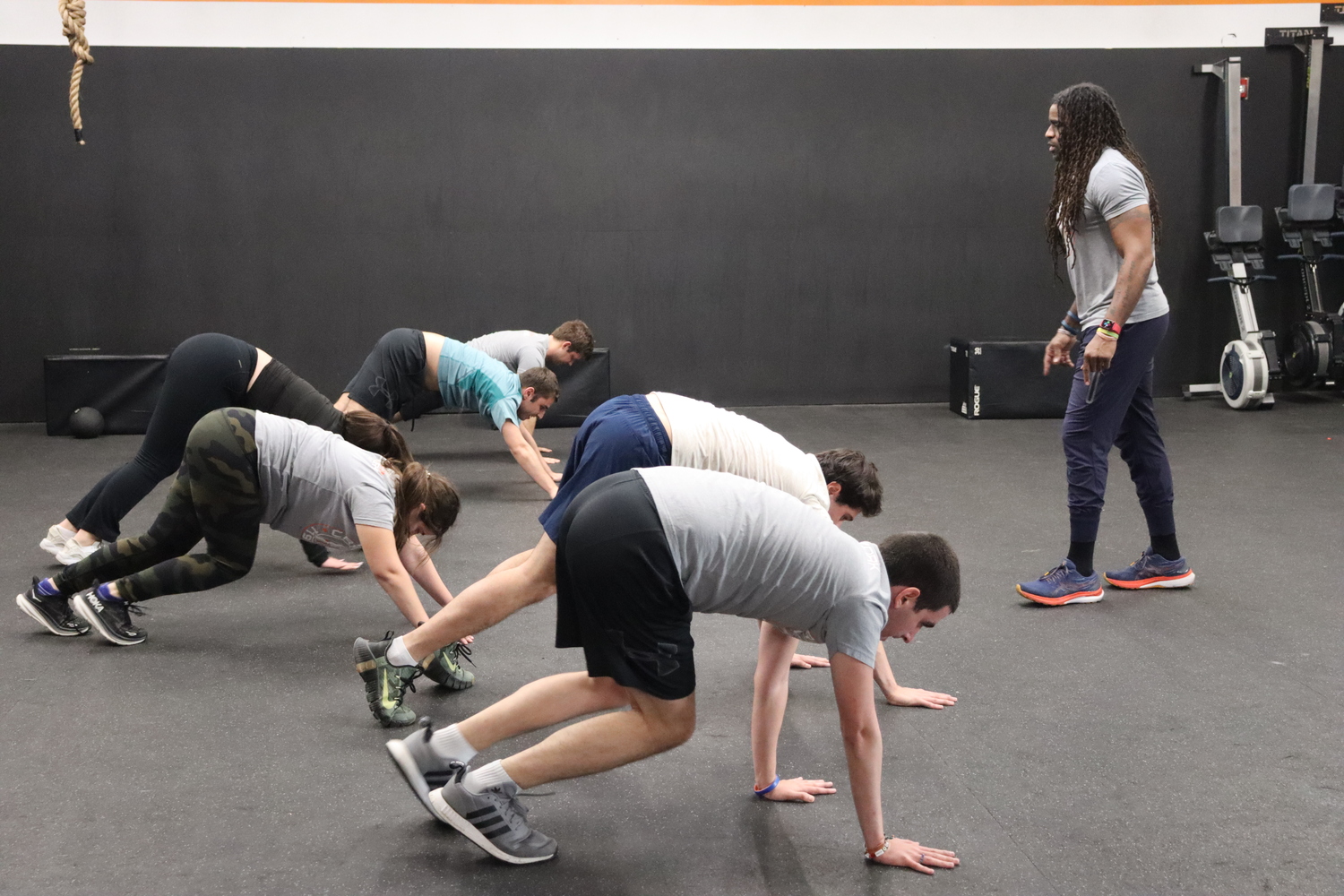 Claude Saturnin earned his level one and level two CrossFit certification and now teaches the classes for several of the autistic adults he works with. CAILIN RILEY