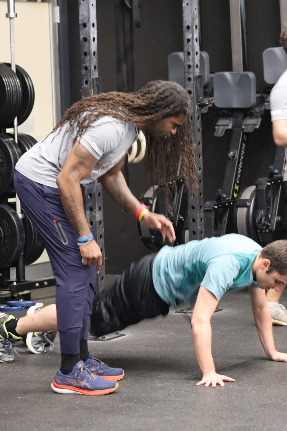 Claude Saturnin works with Michael Kessaris on his form. CAILIN RILEY