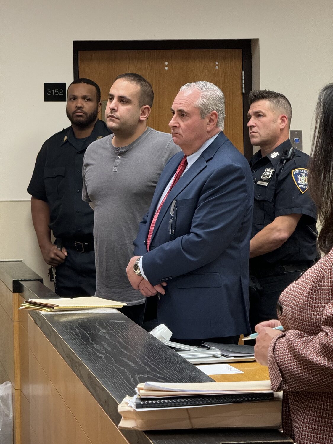 Mark Ripolone, in the gray T-shirt, with his attorney, Jeremy Scileppi, listen as Justice John Collins tells him 