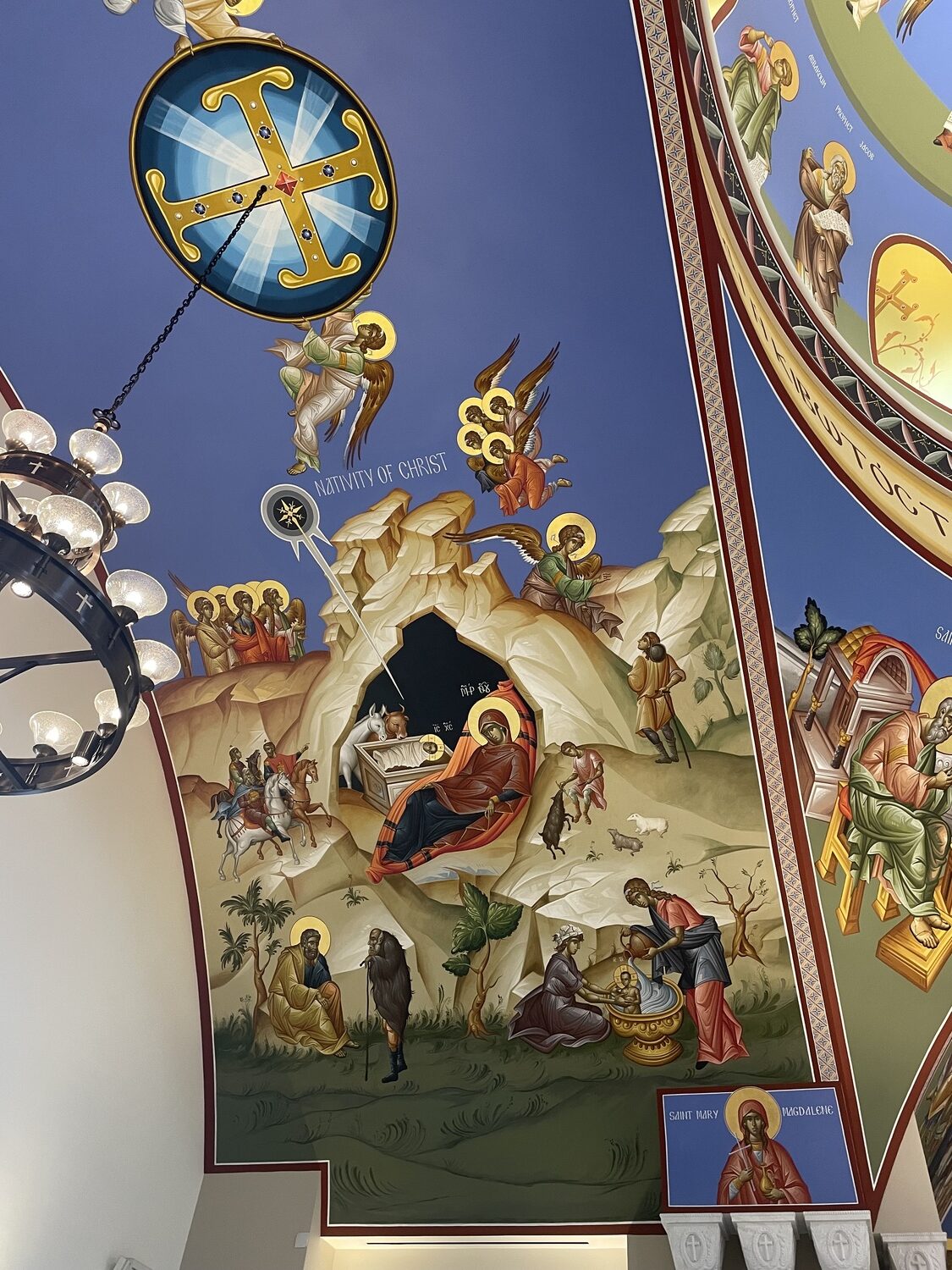 The nativity scene rendered in artwork on the ceiling of the church. CAILIN RILEY