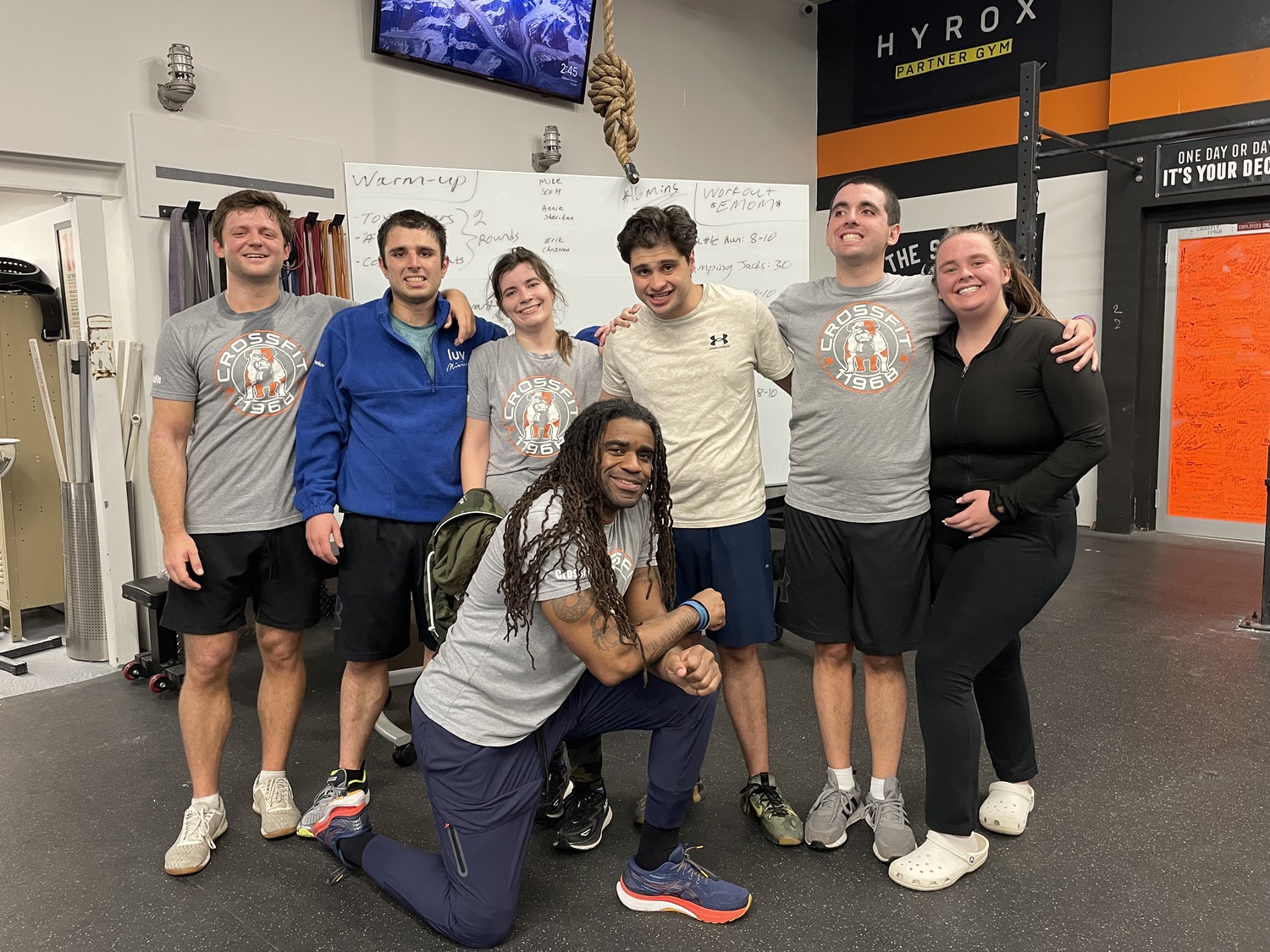 Claude Saturnin (kneeling in front) with, from left, Scott Rodeo, Michael Kessaris, Sheridan Basso, Christian Ciardello, Eric Damon, and Annie Smith. CAILIN RILEY