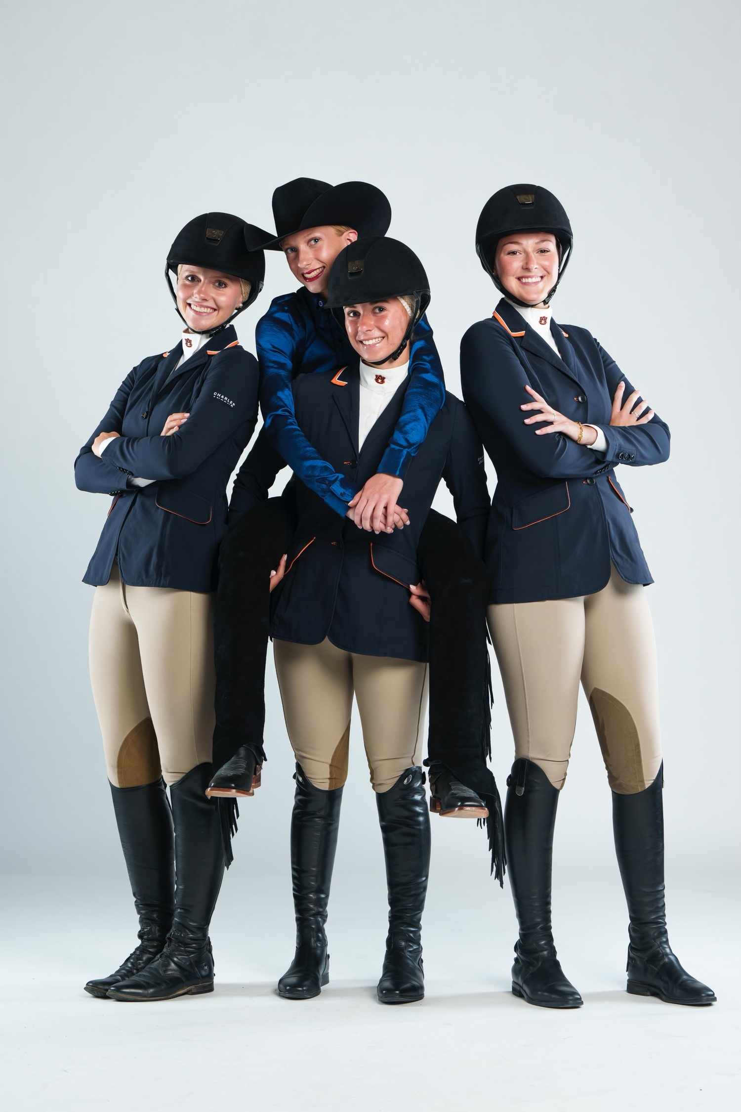 ESM graduate Sadie Berkhout (center) with members of the Auburn University Equestrian Team. Auburn's team is ranked number one in the country.