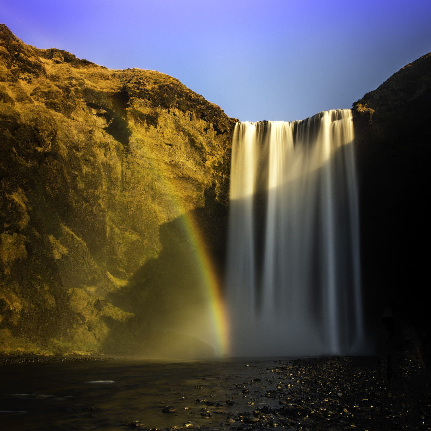 A Skogafoss waterfall with a rainbow.