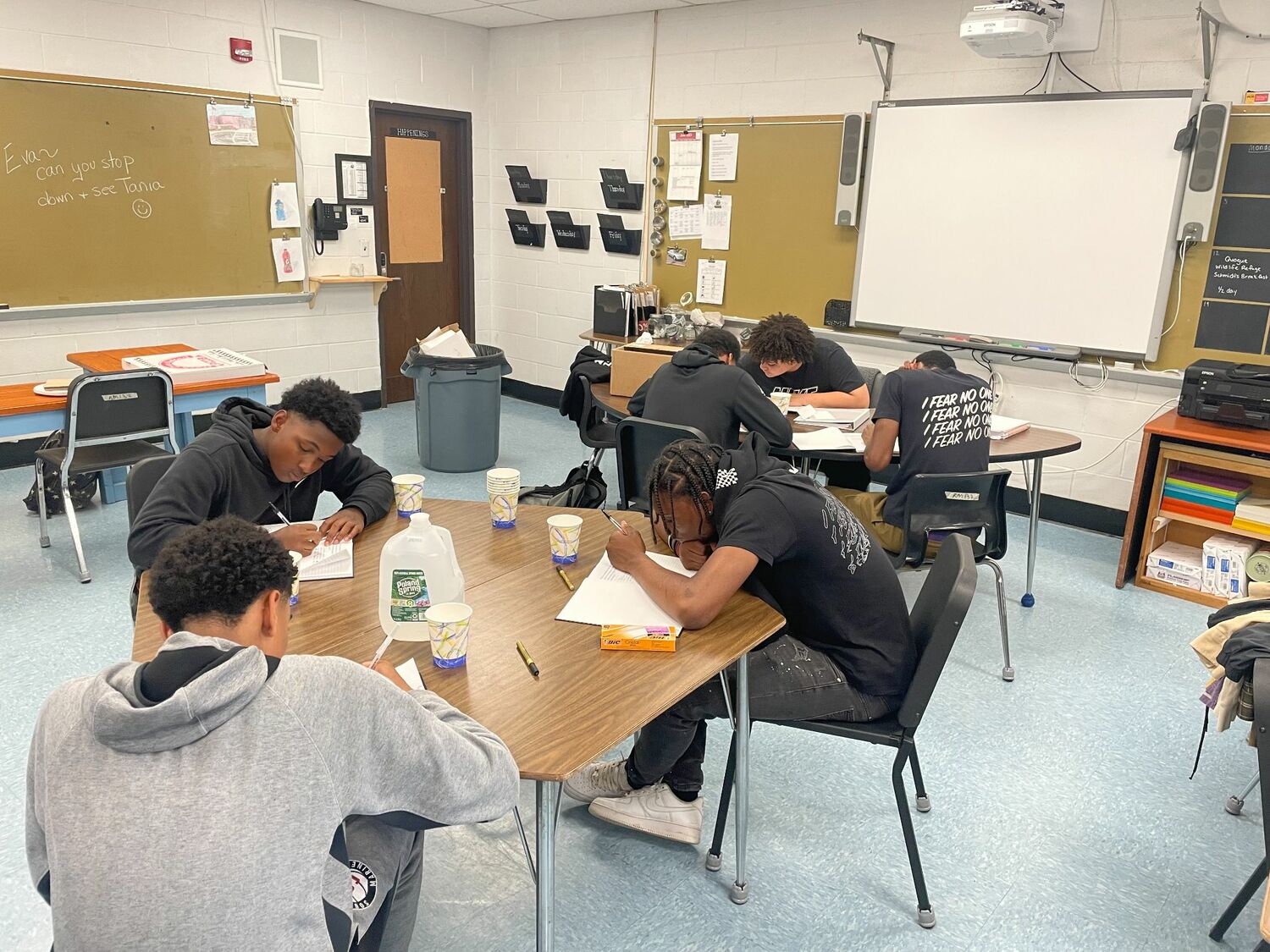 Members of My Brother's Keeper write in their journals during a mentoring meeting. COURTESY SHAWN SMITH