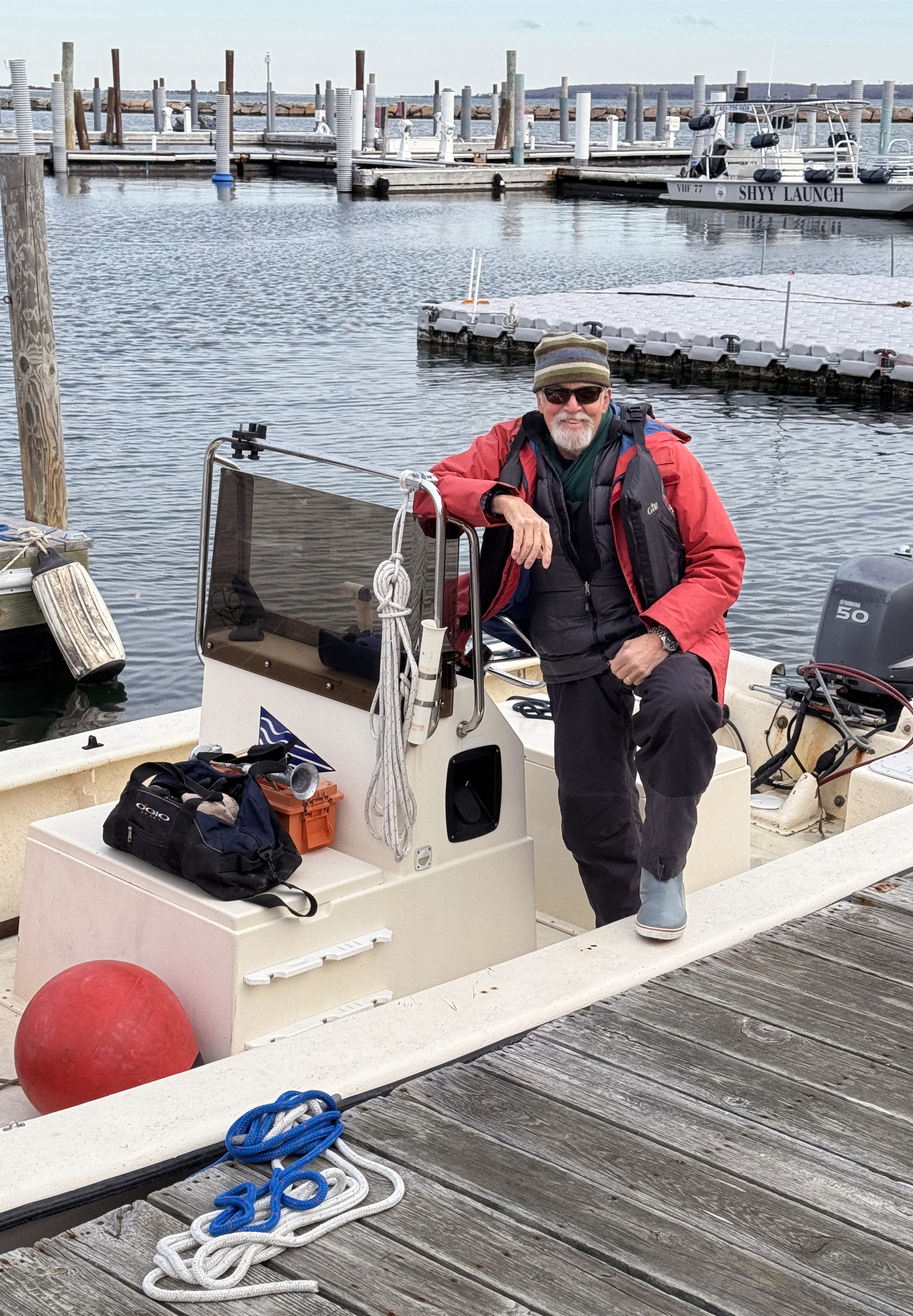 Marty Knab snaps a photo of race committee skipper/photographer Michael Mella before heading out to help set up the race course buoys.   MARTY KNAB