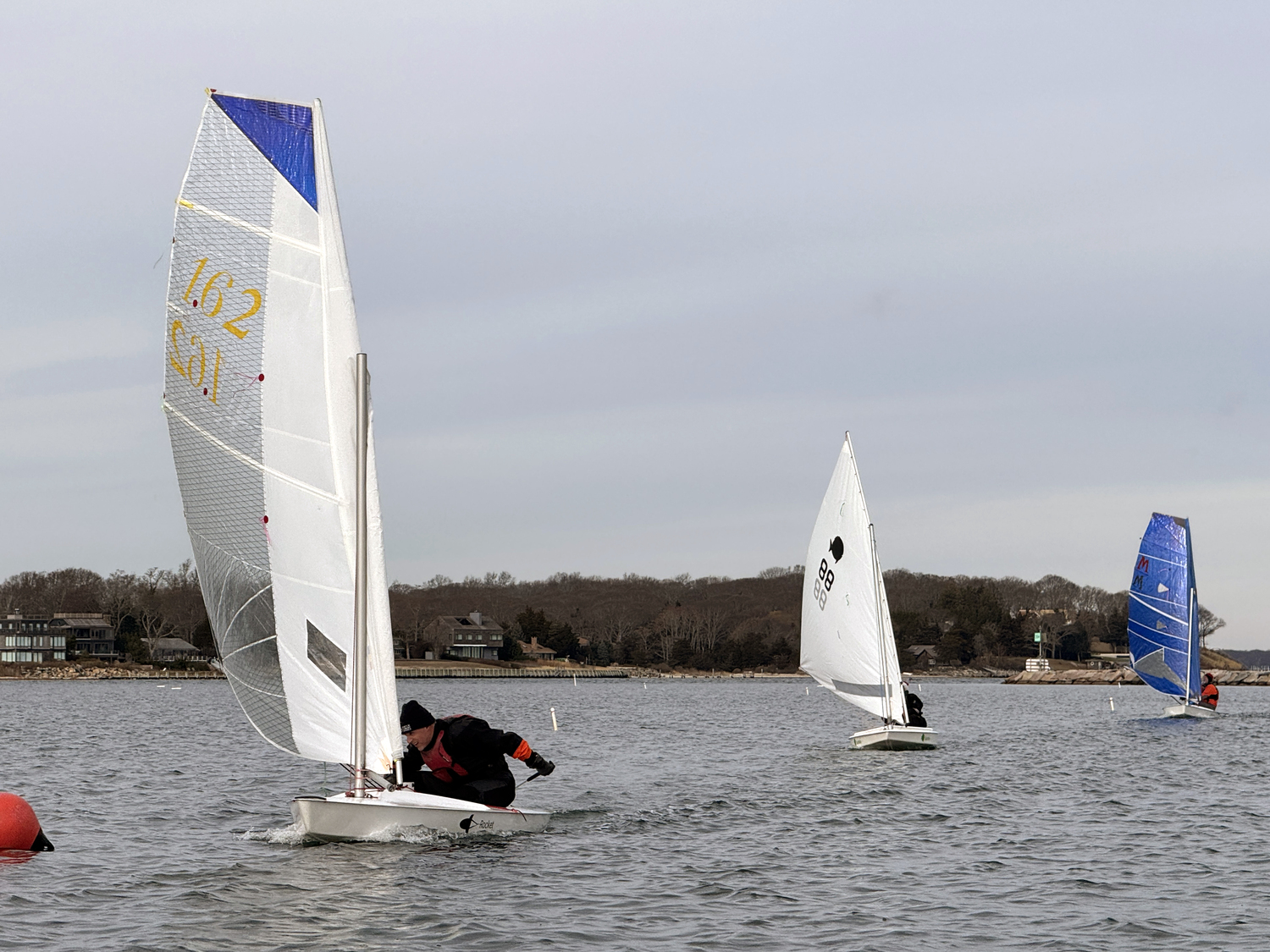 Breakwater Sailing Center Yacht Club commodore Nick Gazzolo leads Joan Butler and Marty Knab to a turning mark in a “Figure 4” race.   MICHAEL MELLA