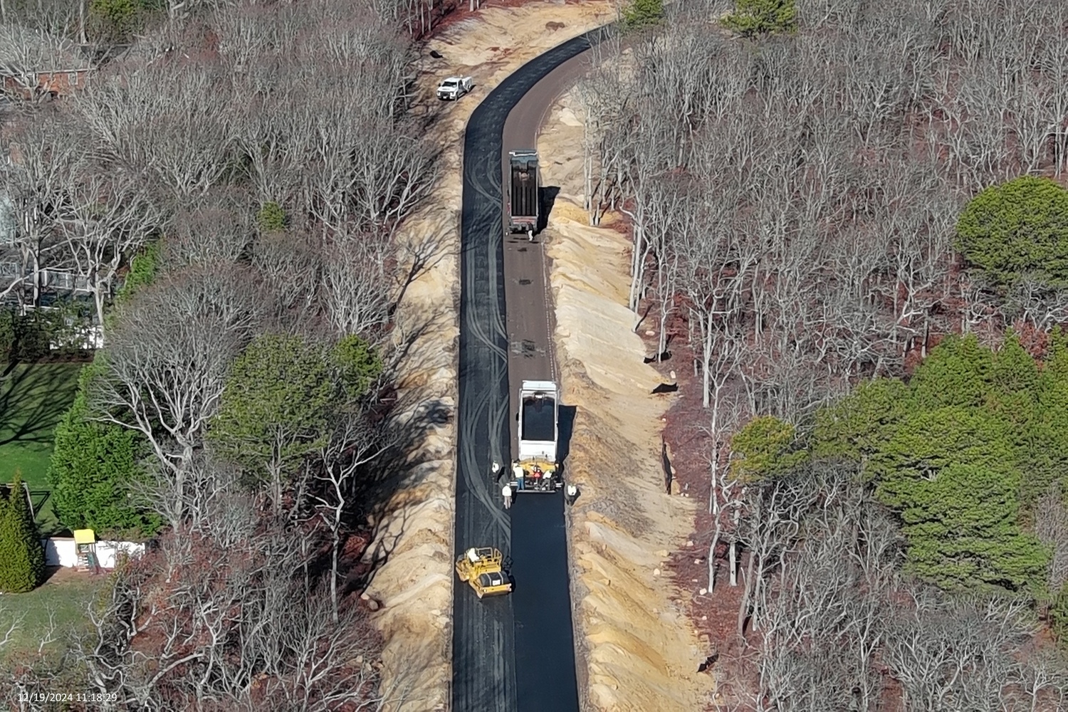 Crews working for the Shinncock Nation on Thursday began paving the nearly 1,000-foot access driveway to the gas station the tribe is constructing off Newtown Road in Hampton Bays.