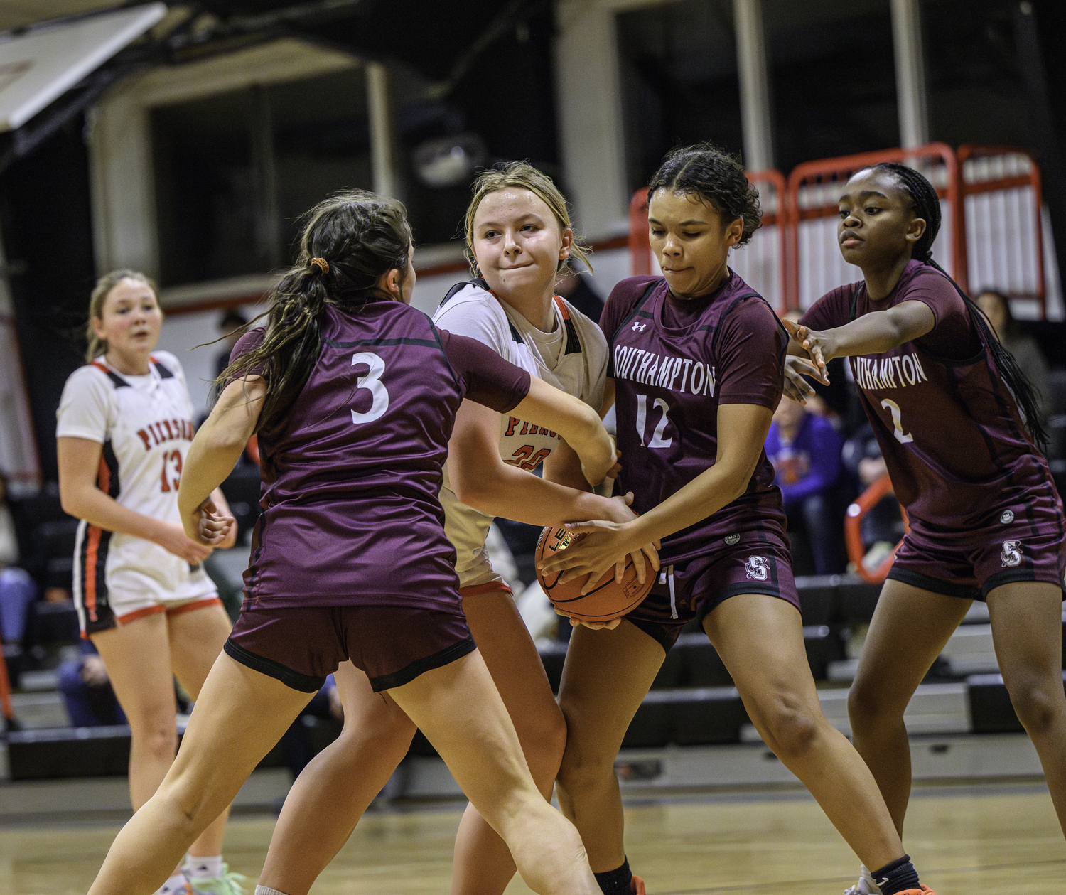 Pierson's Skye Smith is stopped by Mariners Maggie Glanz (3) and Mya Halsey.   MARIANNE BARNETT