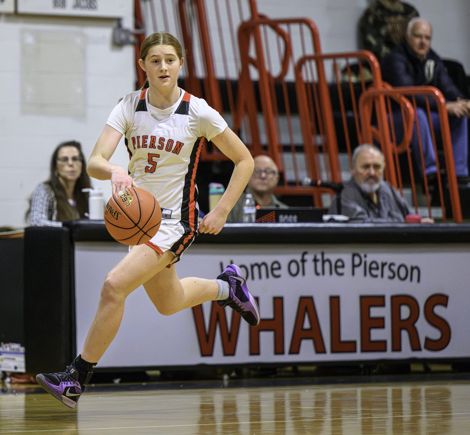 Pierson's Josie Mott races down the court.  MARIANNE BARNETT