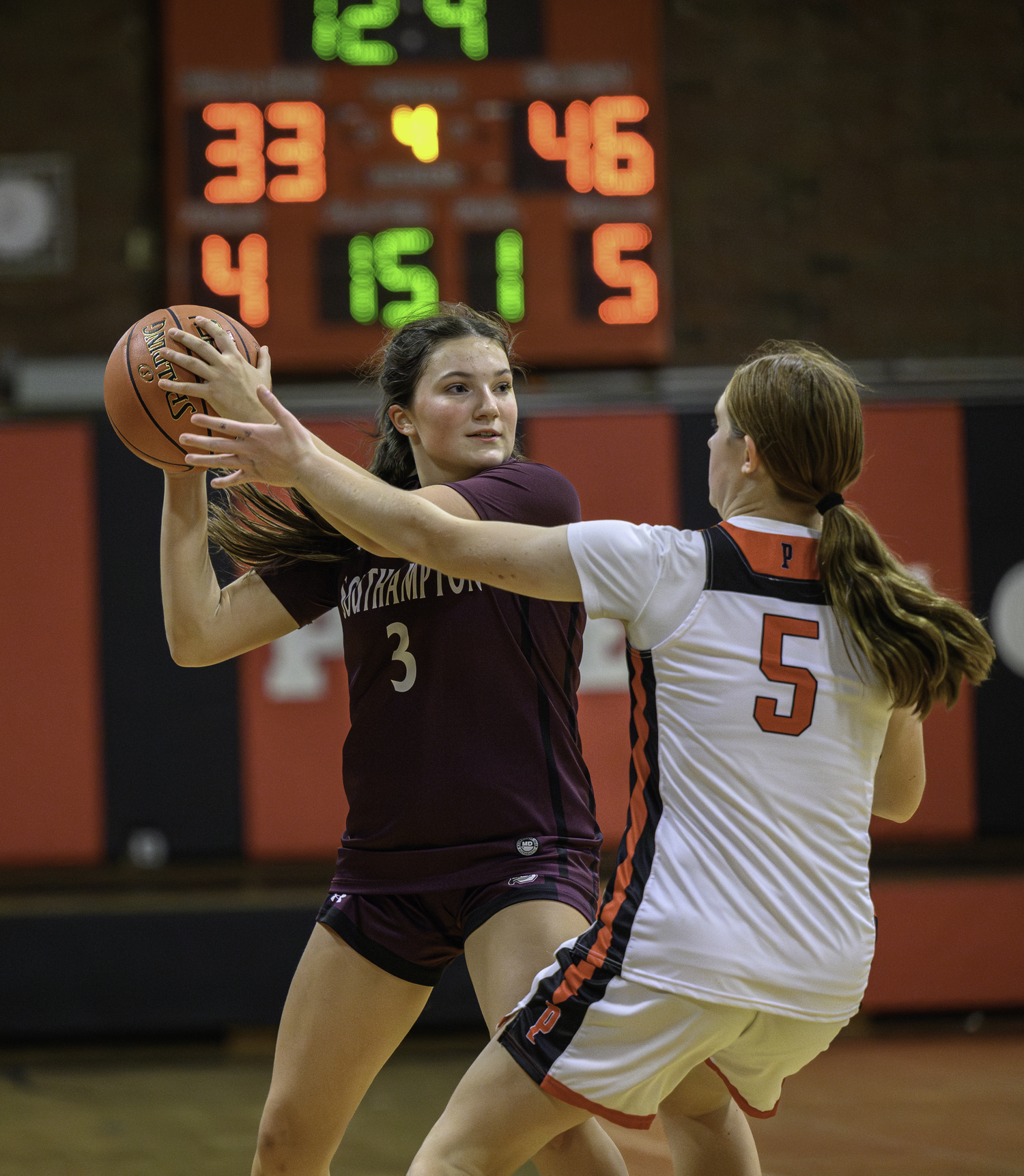 Junior Maggie Glanz keeps the ball moving as the Mariners just look to run out the game's final seconds.  MARIANNE BARNETT