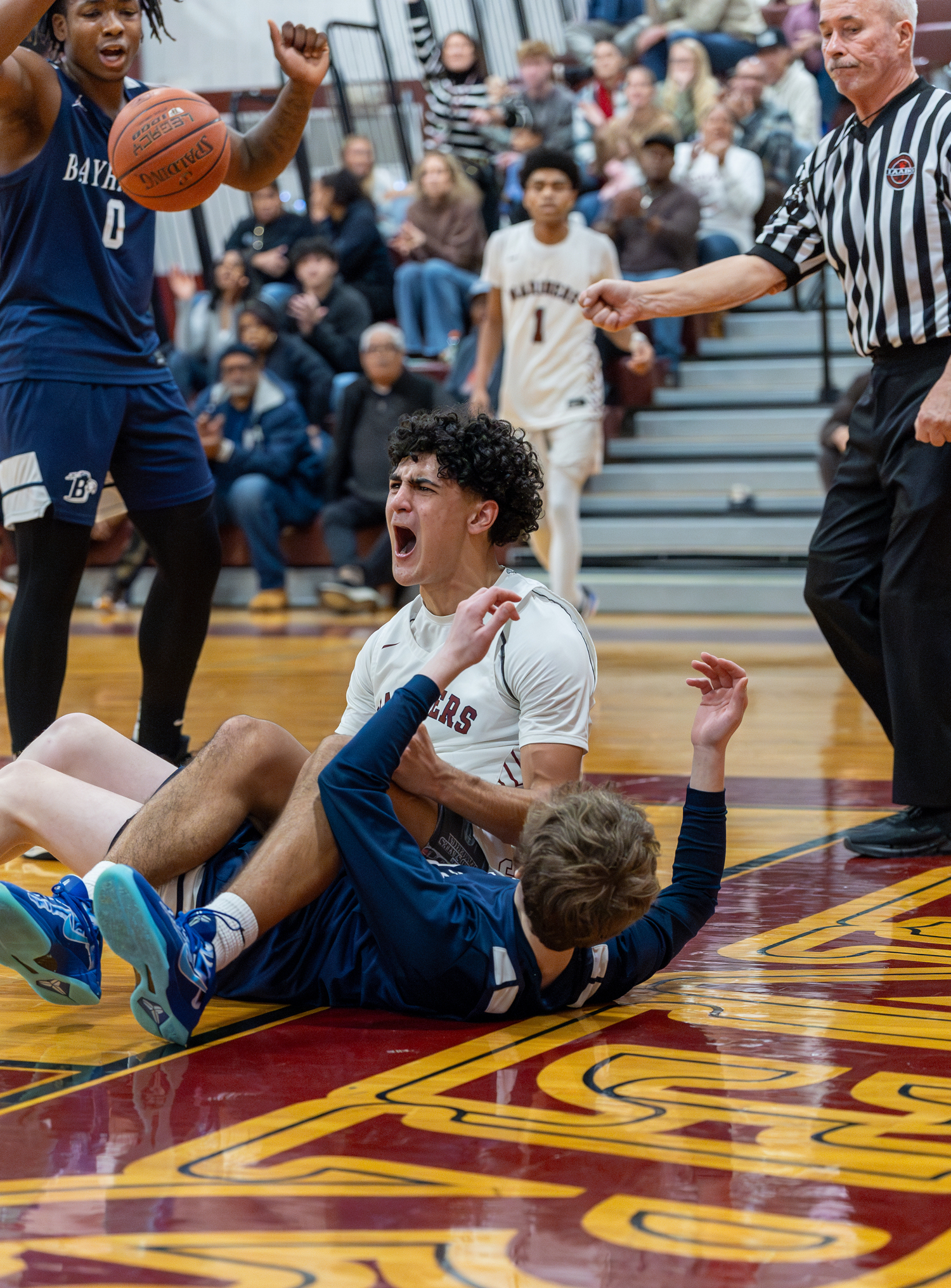 Southampton junior Alex Franklin reacts after making a layup while being fouled by St. Dominic's Harrison Van Essen.   RON ESPOSITO/SOUTHAMPTON SCHOOL DISTRICT