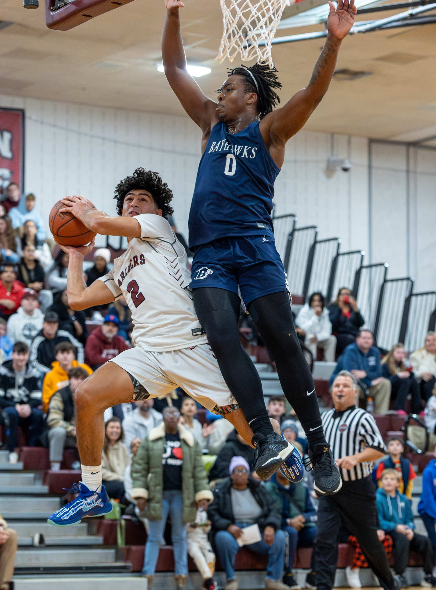 Southampton junior Alex Franklin absorbs some contact from St. Dominic's Adam Jerome.  RON ESPOSITO/SOUTHAMPTON SCHOOL DISTRICT