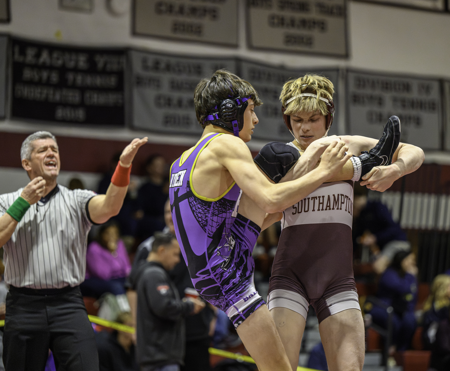 David Lewin goes to sweep the leg of his Hampton Bays opponent. MARIANNE BARNETT