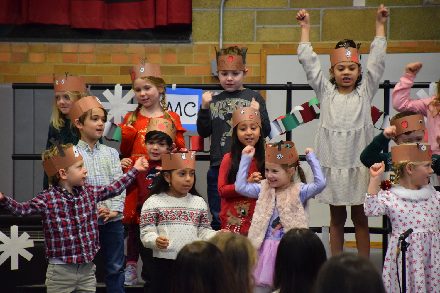 Kindergarten students at Sag Harbor Elementary School recently performed
the annual Holiday Sing for their schoolmates and parents during Morning Program. The
concert was under the direction of music teacher Deanna Locascio and art teacher Shelby Fullam. In Fullam’s class, students made reindeer crowns and decorations
for their set, such as snowflakes. They performed several songs including “Rudolph, the Red-Nosed Reindeer,” and the class favorite, “Feliz Navidad.” COURTESY SAG HARBOR SCHOOL DISTRICT